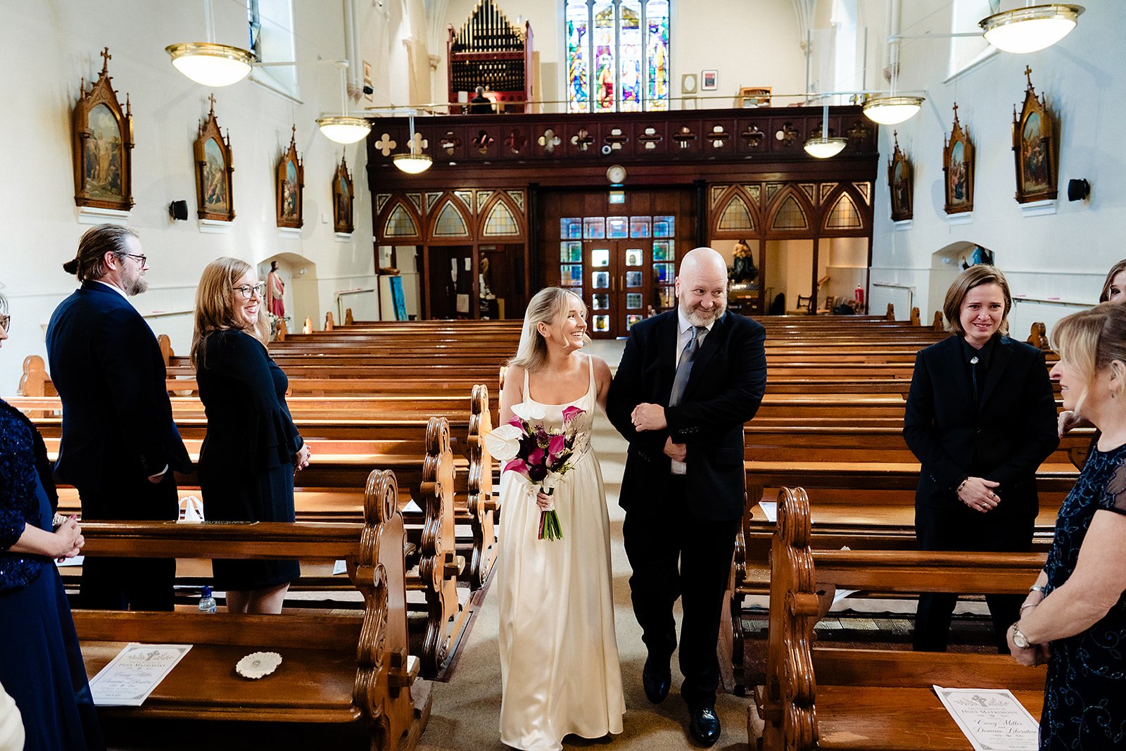 casey walking down the aisle with her dad in enniskerry church