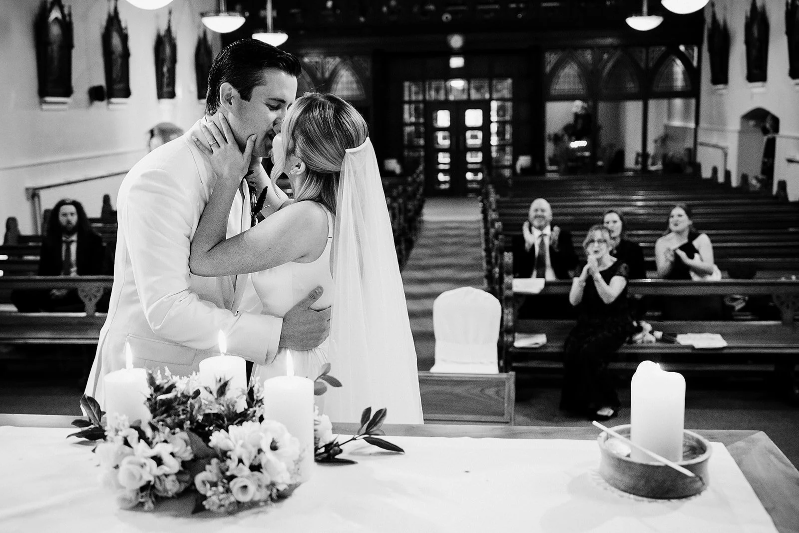 lough-tay-wedding-photographer-casey-dominic-03-first-kiss-family-laughing-black-white.jpg