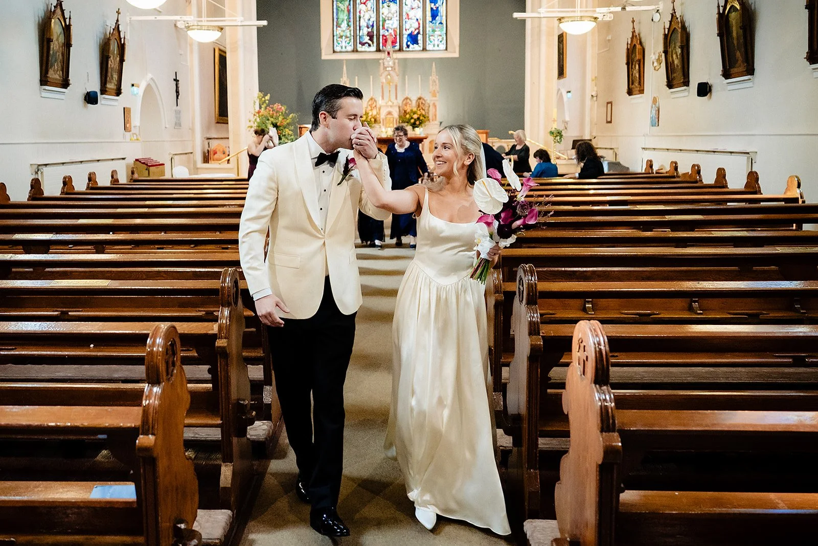 lough-tay-wedding-photographer-casey-dominic-05-recessional-hand-kiss-aisle.jpg