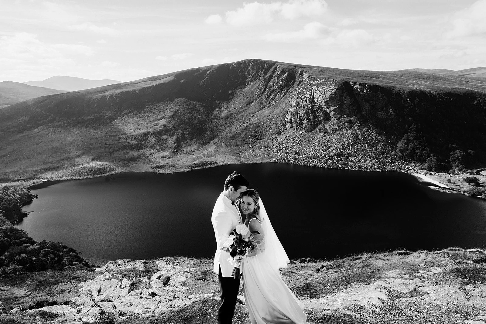 black and white wedding photo with tough tay as the backdrop