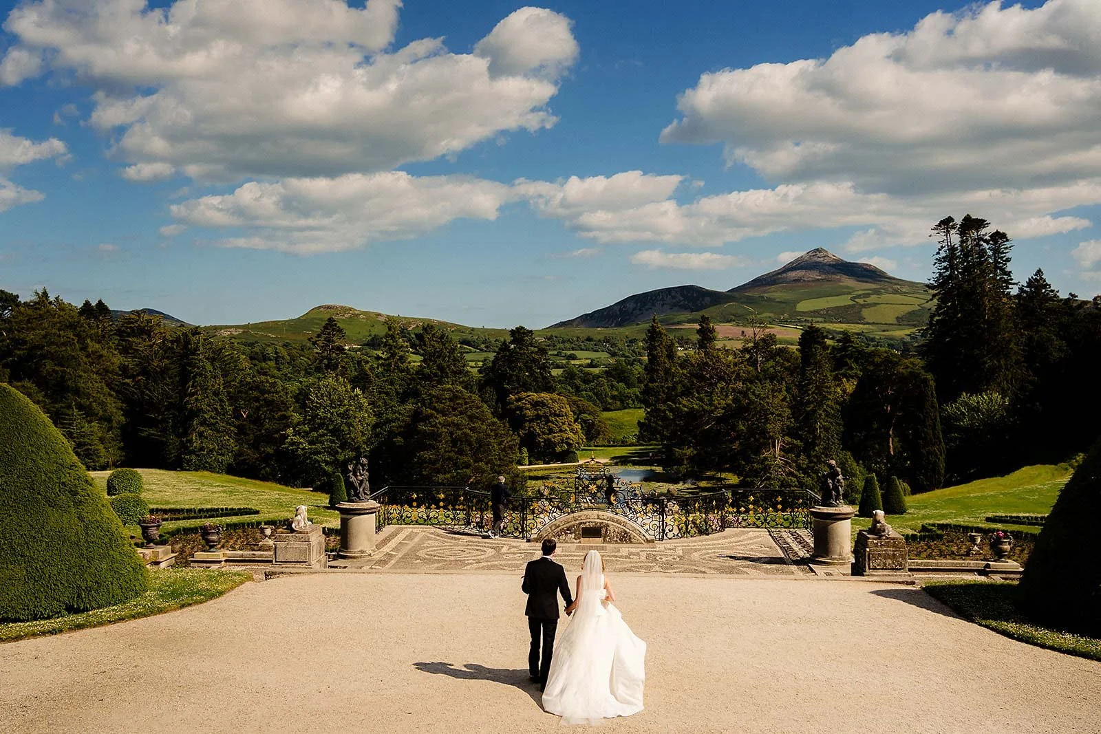 couple looking off into the mountains at Powerscourt