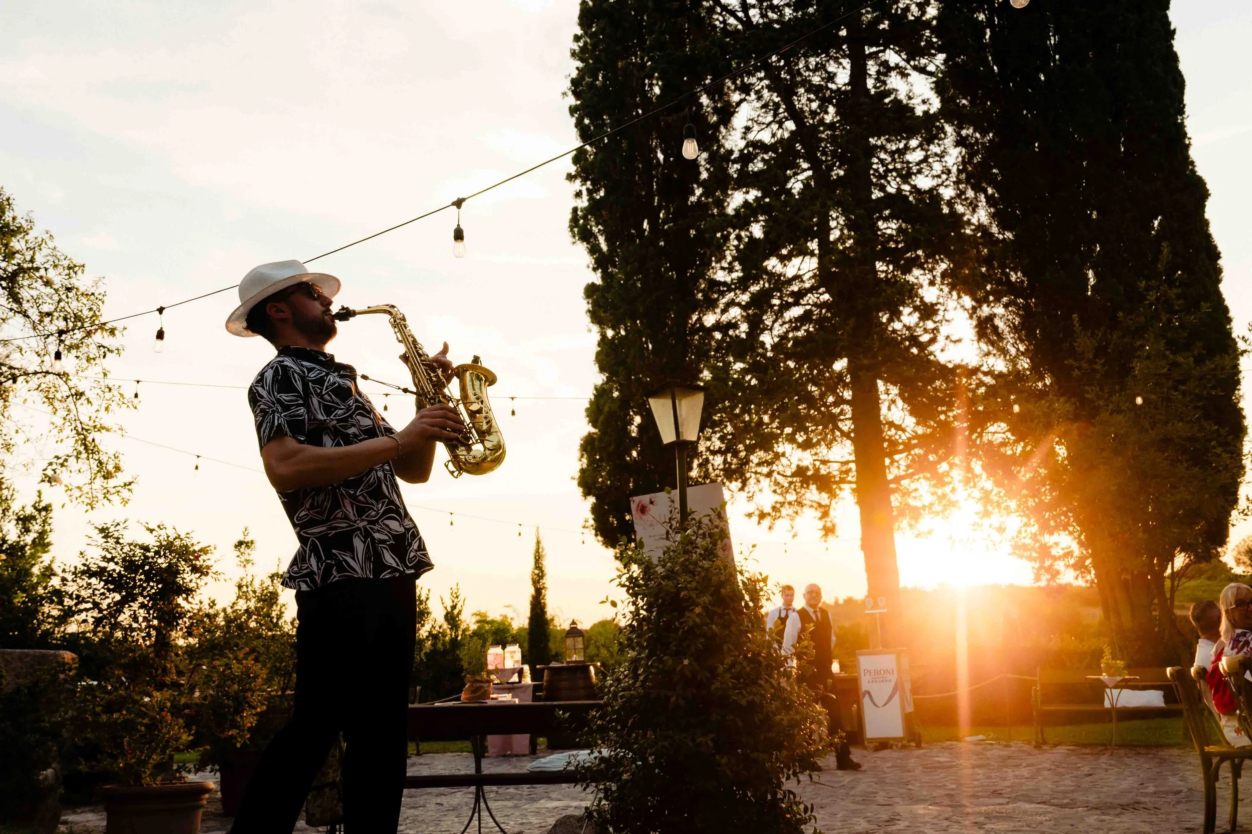 Sax player in the evening sunset in the borgo di tragliata in rome