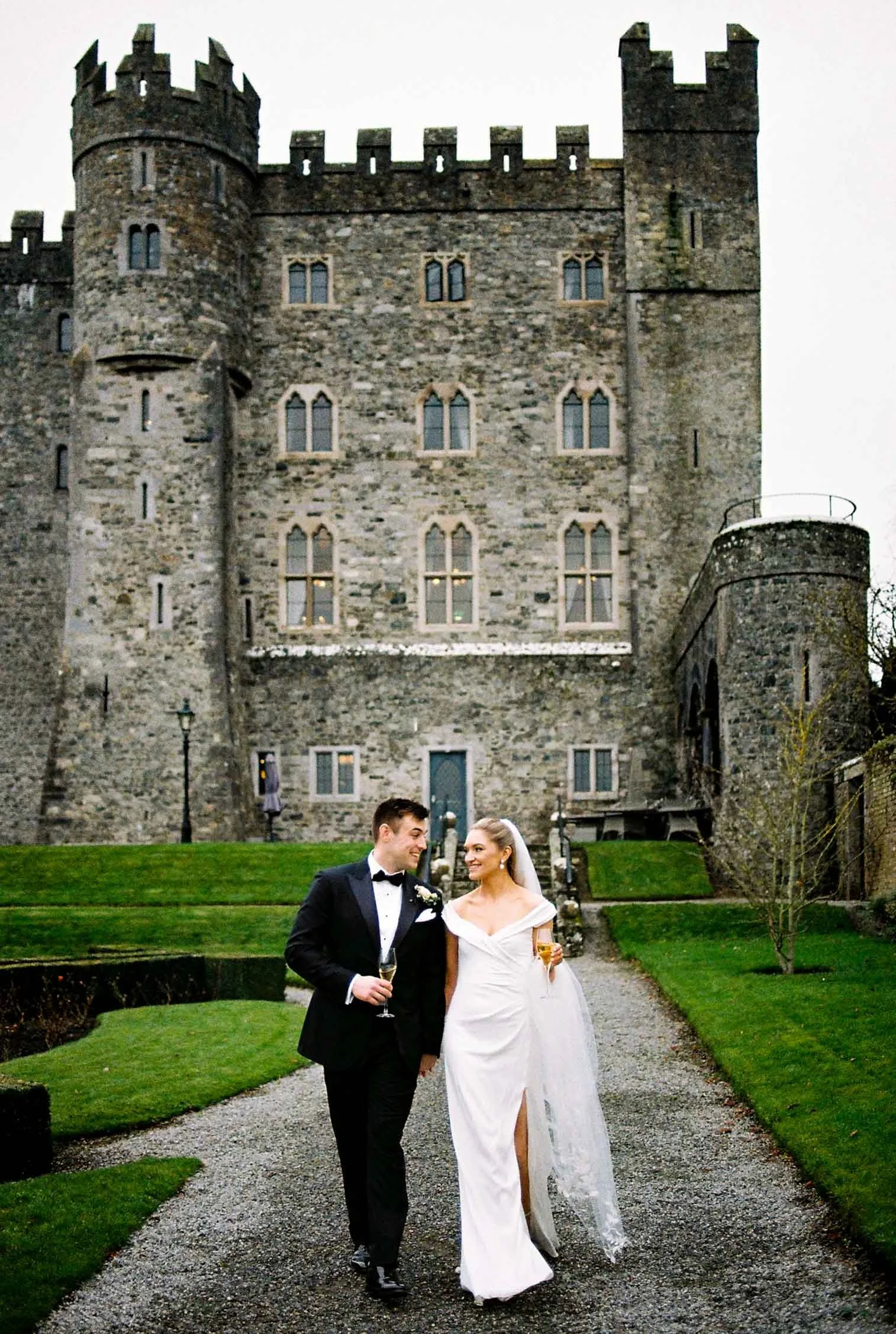 couple with a drink in colour film photography smiling at each other
