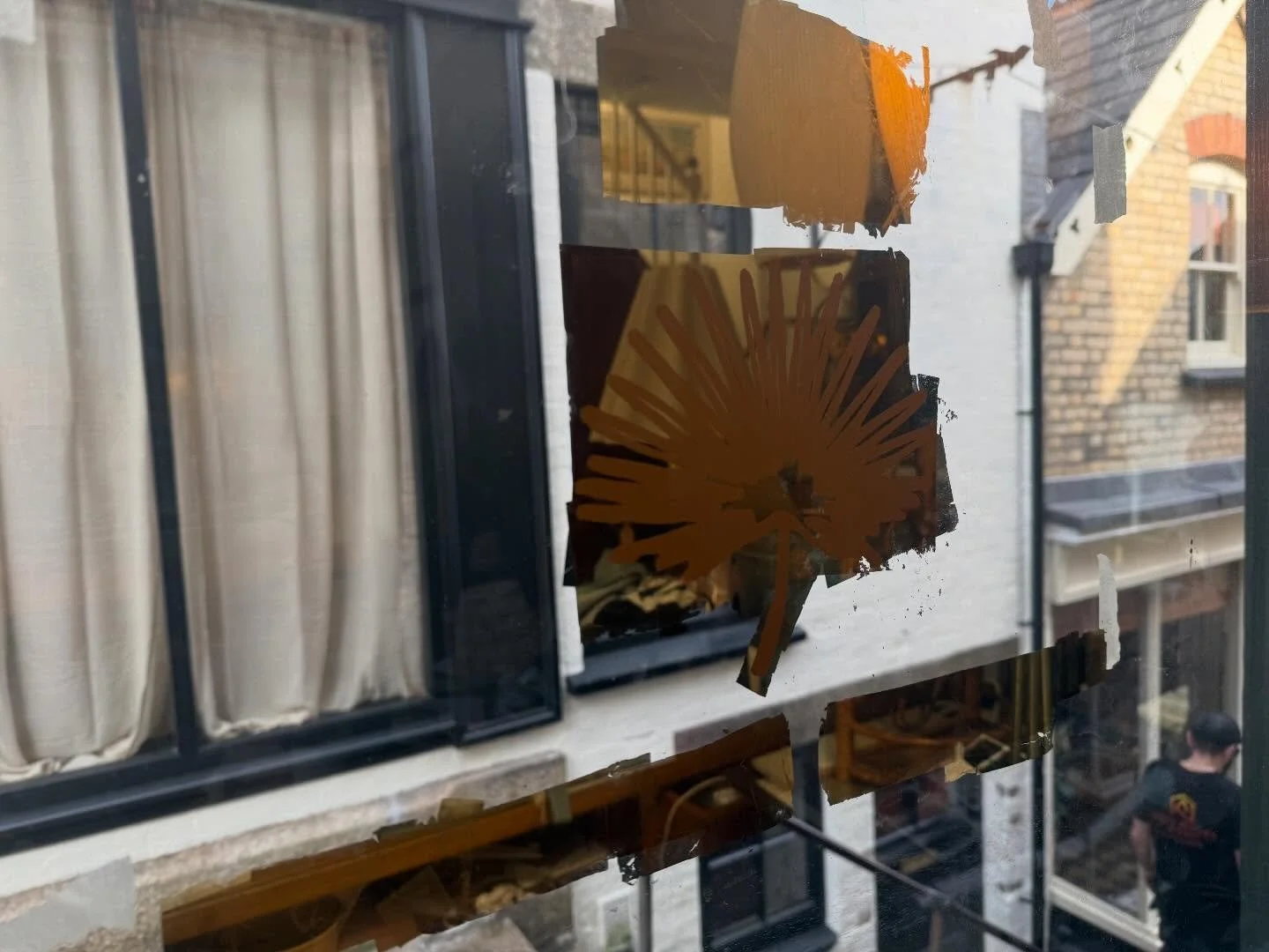 Glittering in the sun! @neilrobsonsigns working on our new windows 🌟🧑&zwj;🎨🖌️