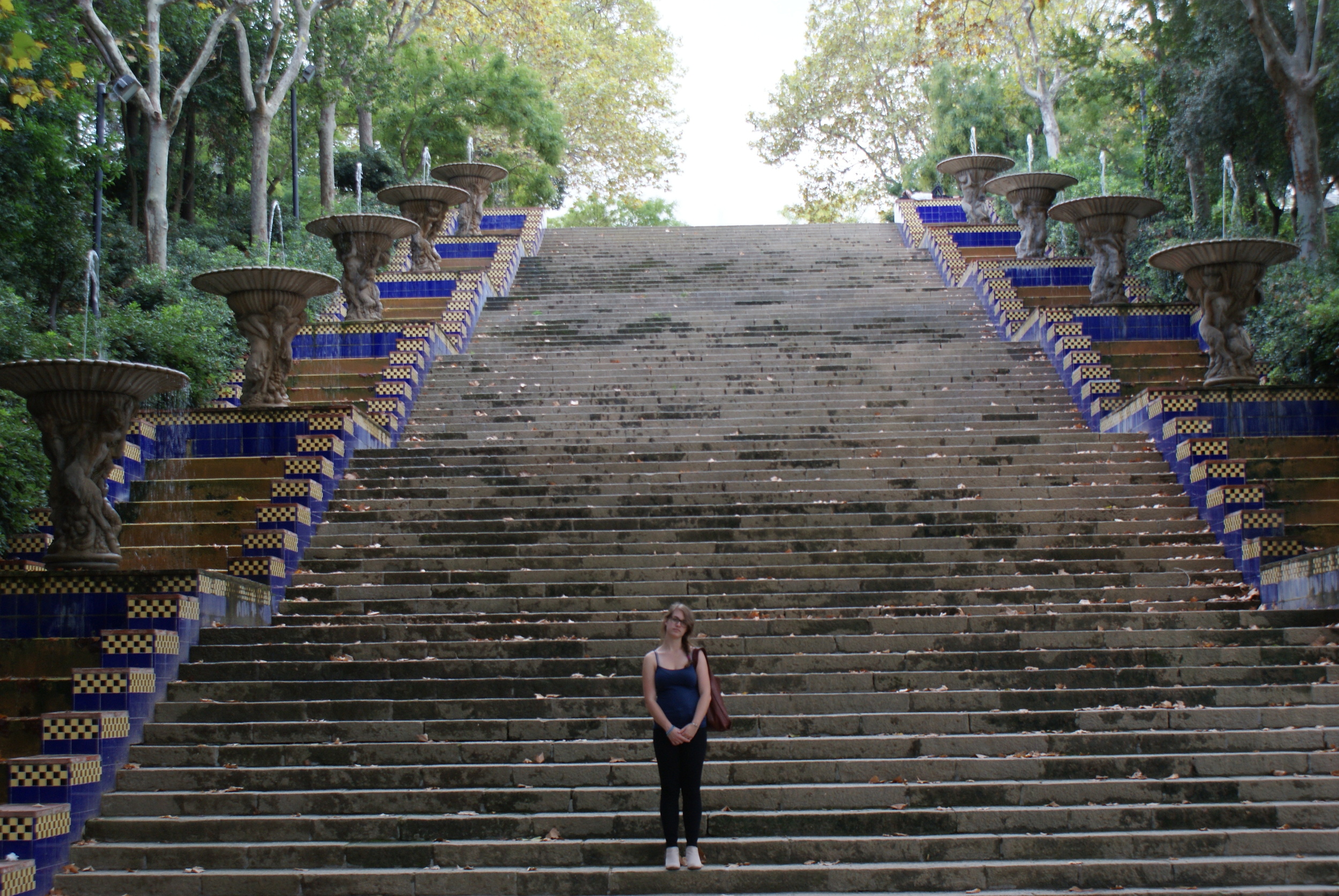 The grand stairs near Olympic Park capture the drama of the space, highlighting the colored tiles and repeating fountains as you ascend towards the relics of games past.