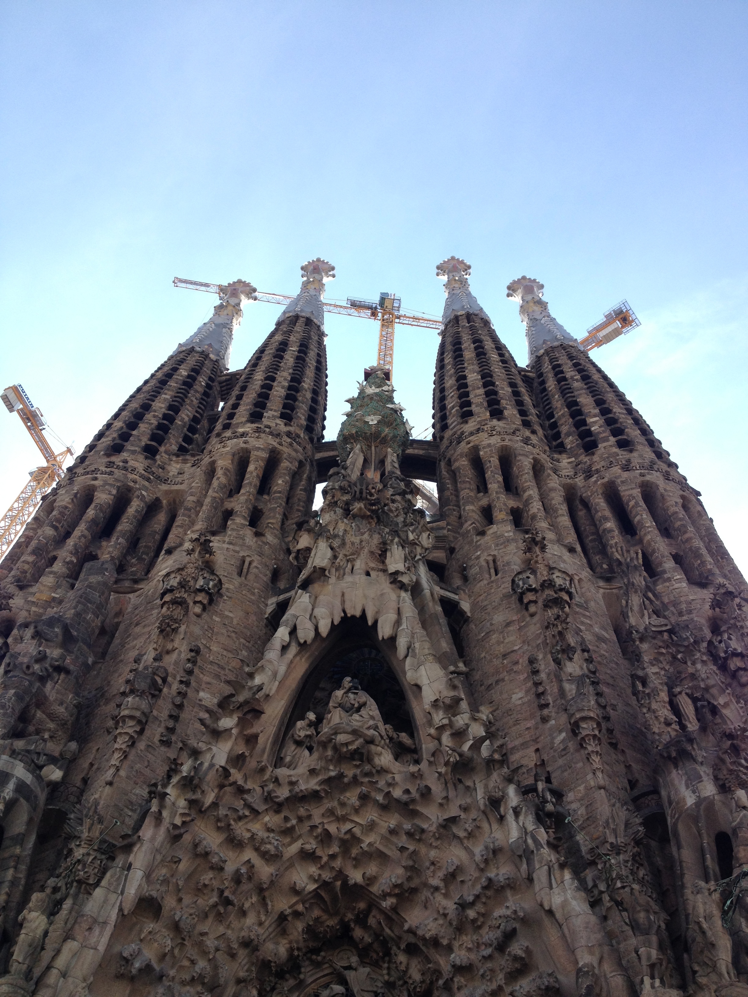 The Sagrada Familia haunts Barcelona from above, it's dripping presence being built slowly for years.