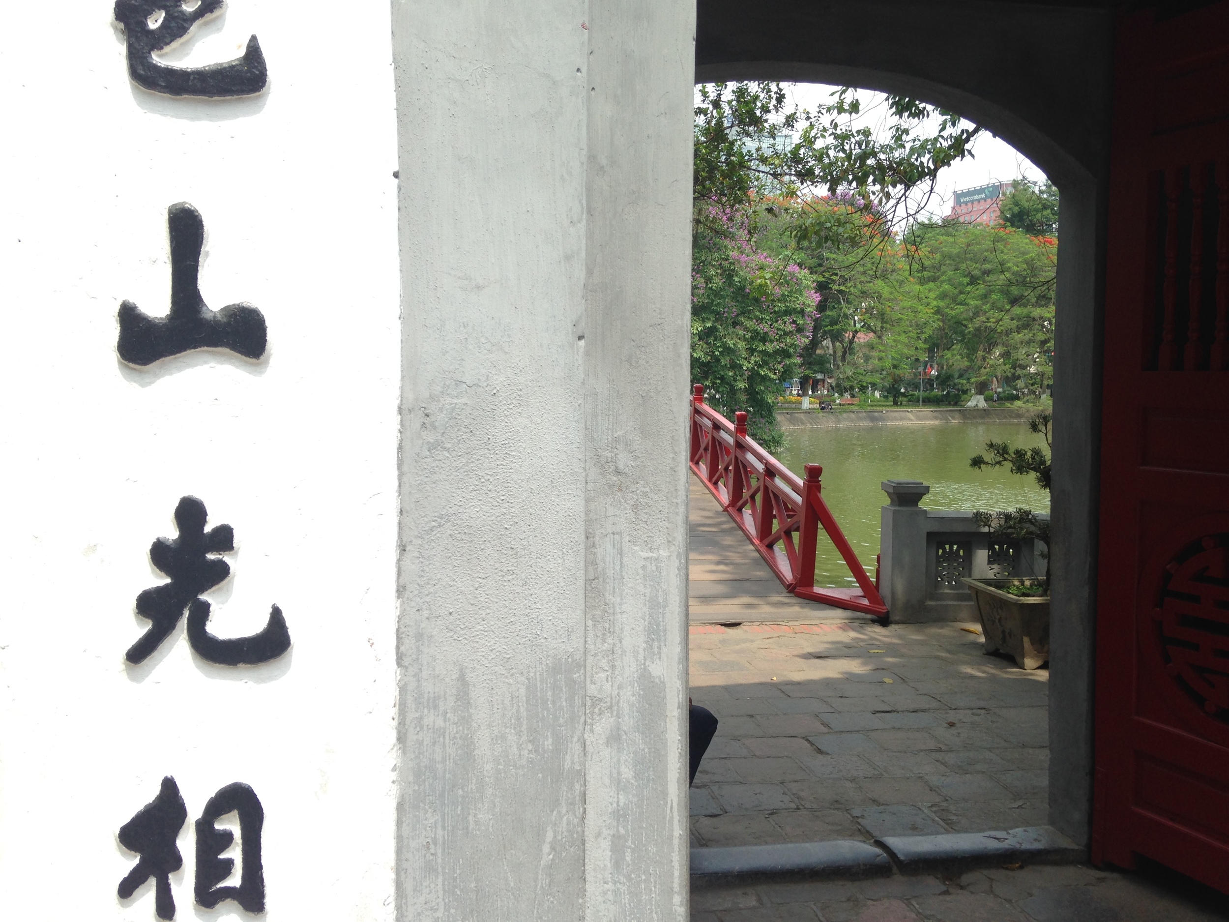 Looking out onto the red bridge and lake. 