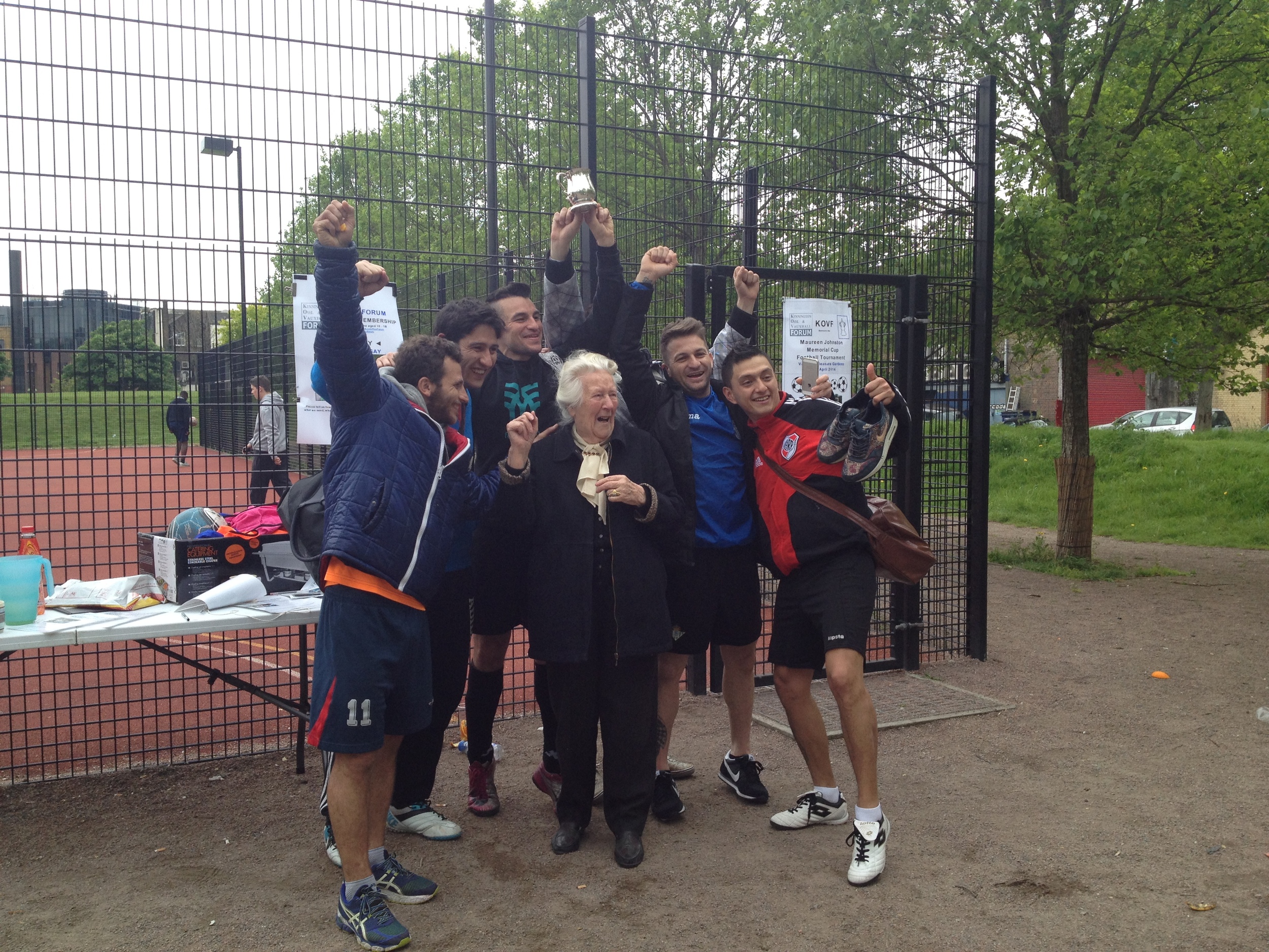 Maureen Johnston's mother with the 5-a-side footballers winners of the Tea Cup trophy named in Maureen's honour