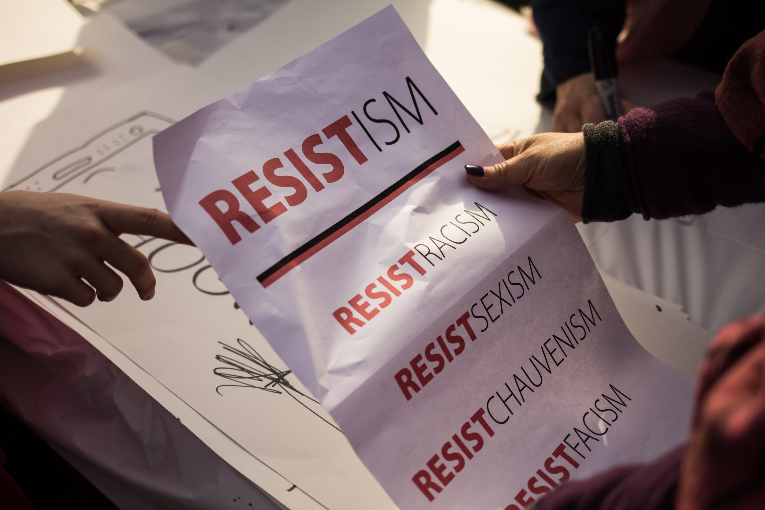 Stamford, Connecticut - January 21st, 2017: A woman holds a flyer being passed out at the Womens March the day after president Trumps inaguration. 