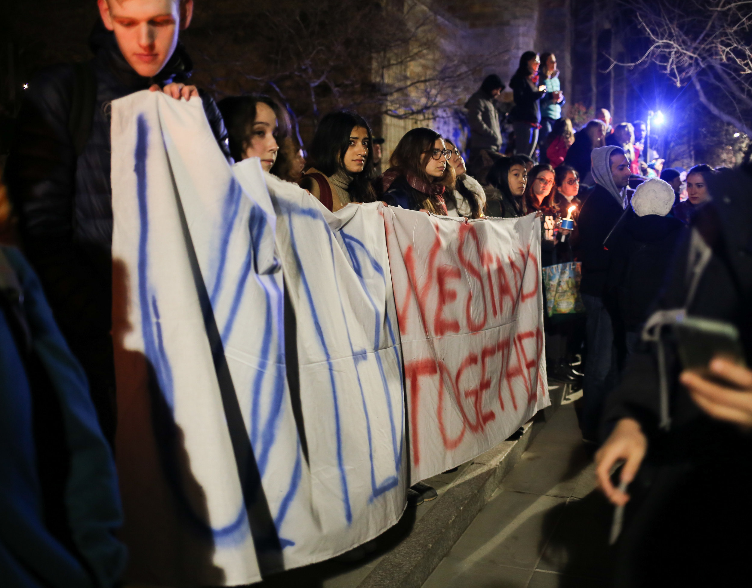   New Haven, Connecticut - January 29th, 2017: Students of Yale University hold a banner stating "United We Stand Together."  