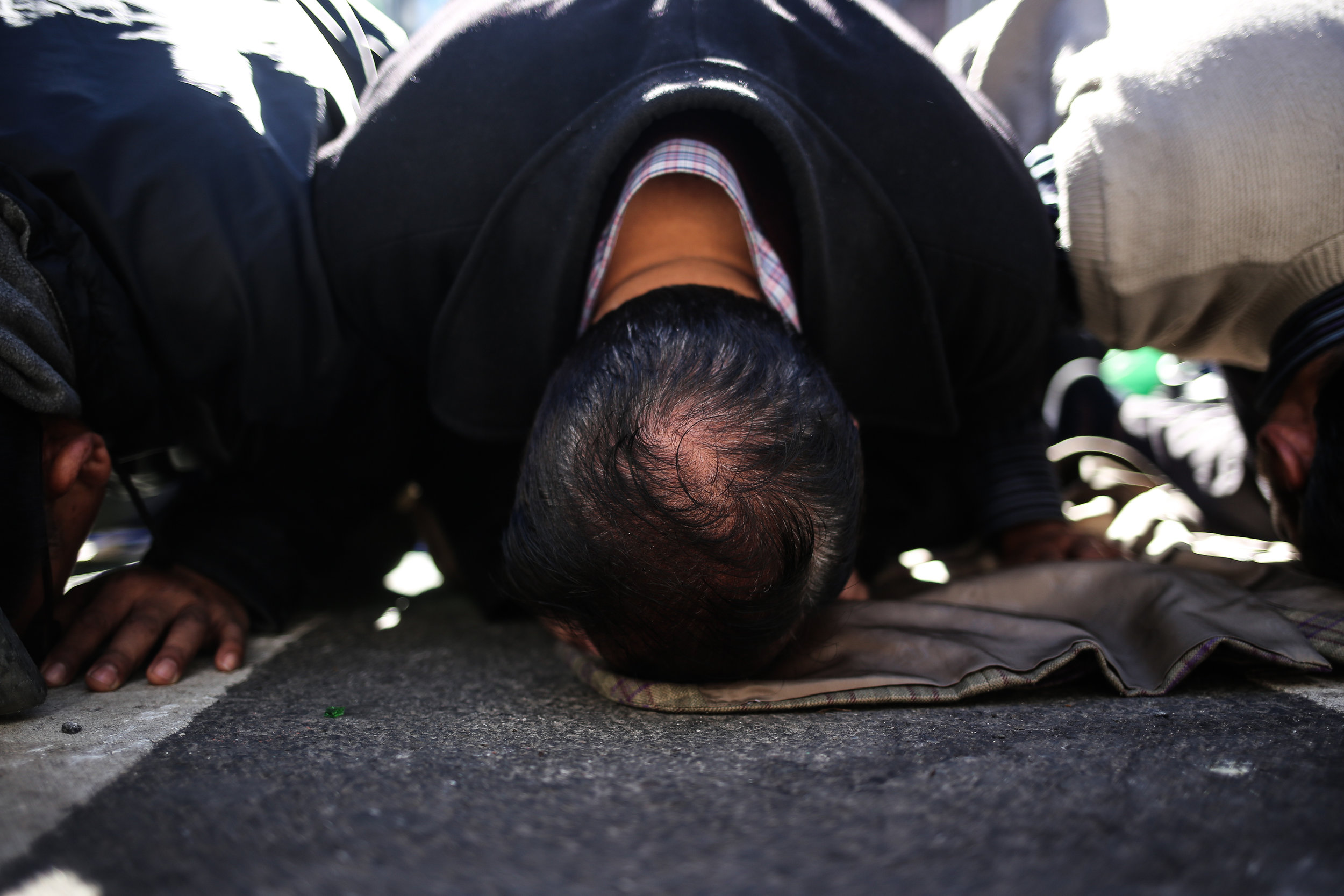  Men pray at the I Am A Muslim Too rally in Times Square // February 19th, 2017 // New York City. 