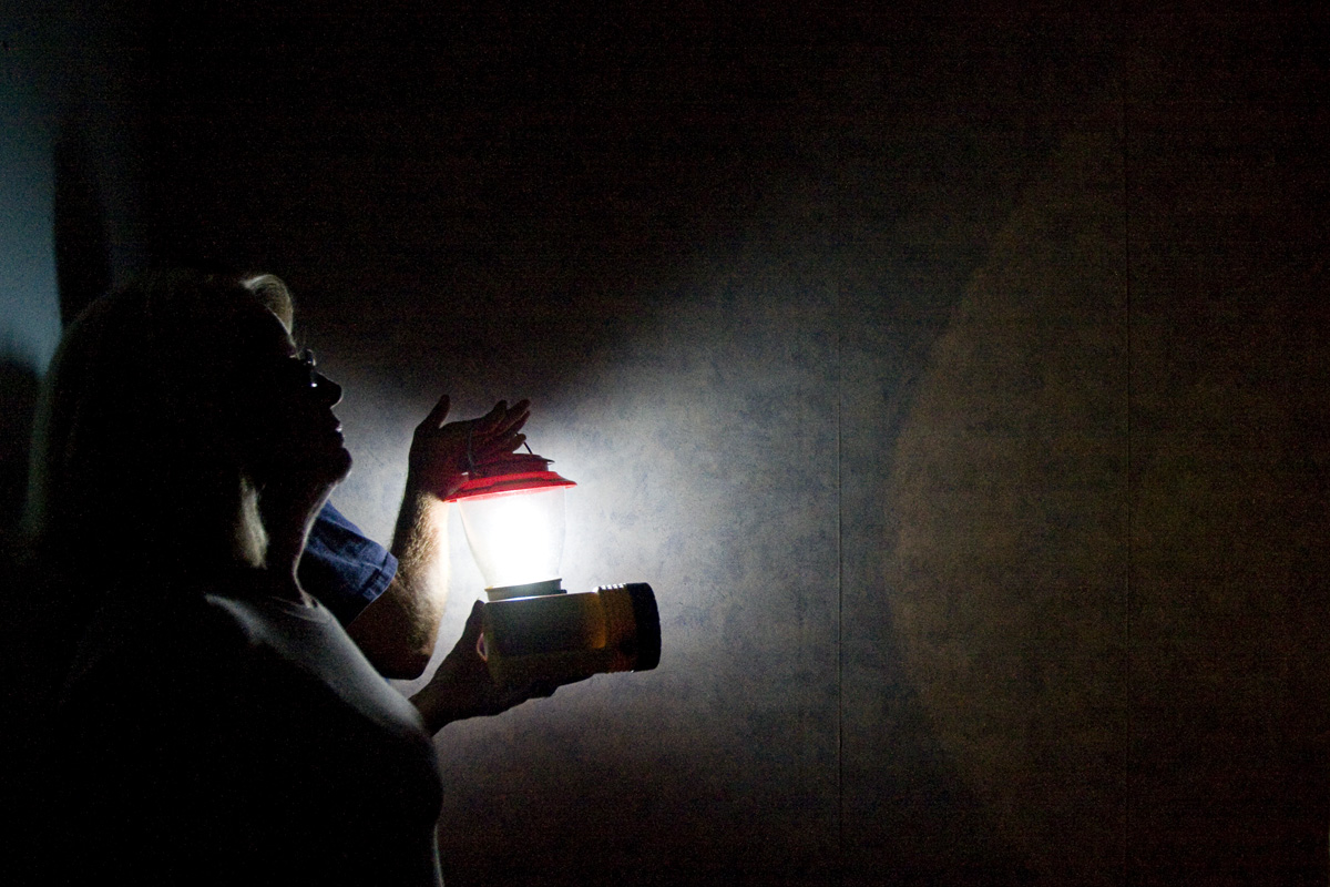 Shirely Barber stands in the basement of what is left of her home with her son Jeremy on October 9, 2010.