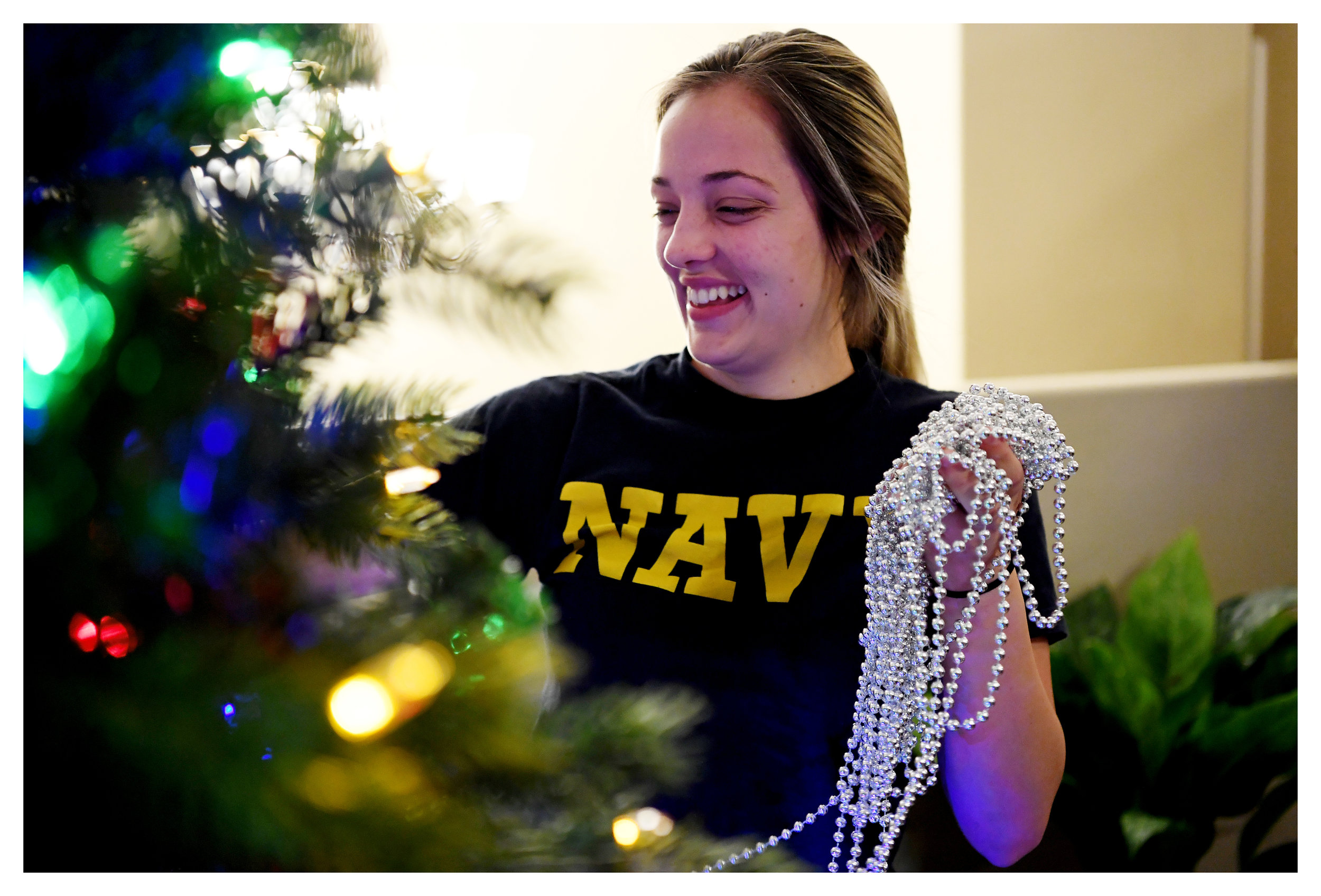  Mariah, a foster child under the care of the Wyatt family, helps decorate the Christmas tree November 30, 2019. She was placed into the foster care system when her parents were overcome with addiction. 