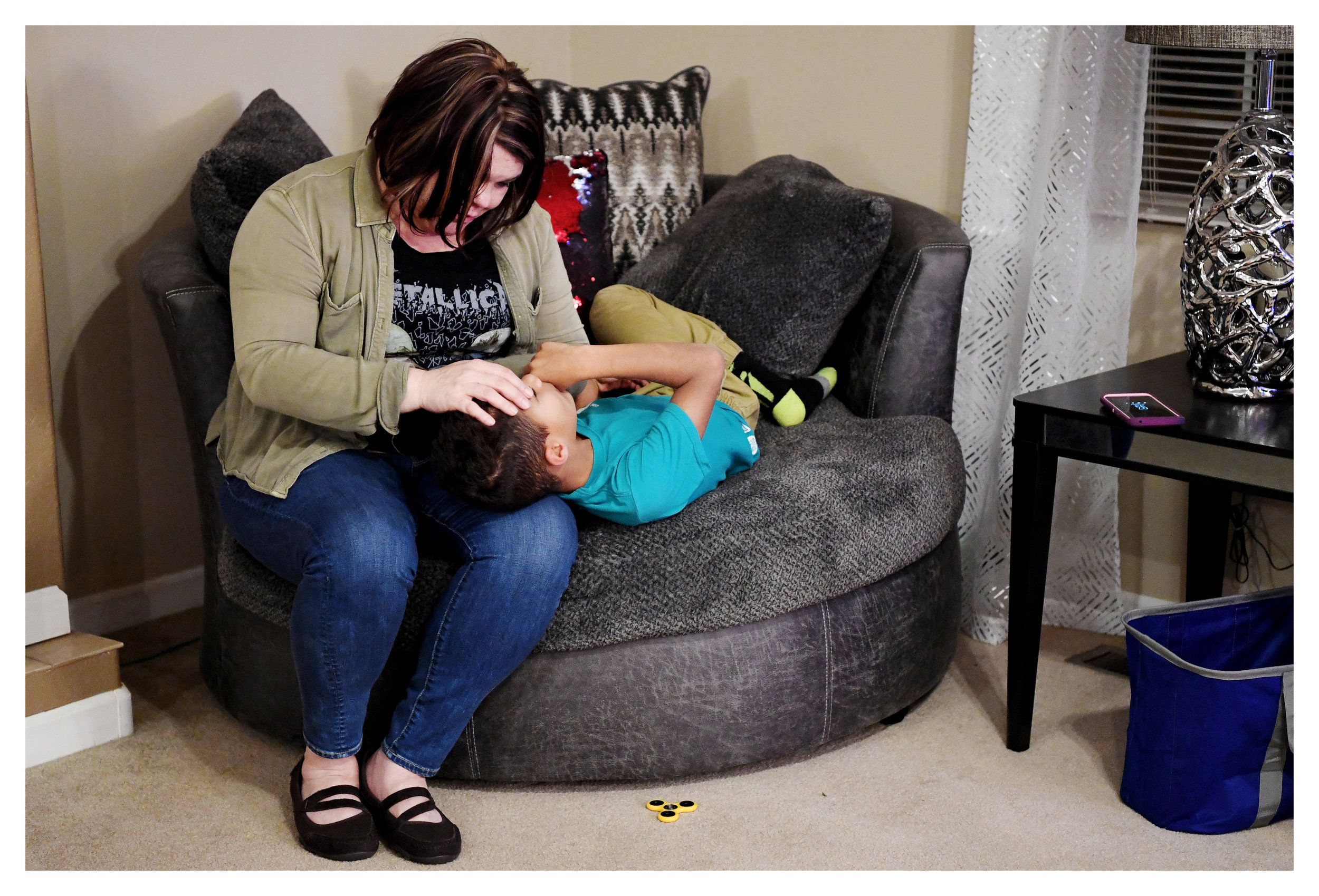  Shantel Wyatt tries to convince Emani, a foster child in her care, to get ready for bed in Burke County, North Carolina, November 30, 2017. 