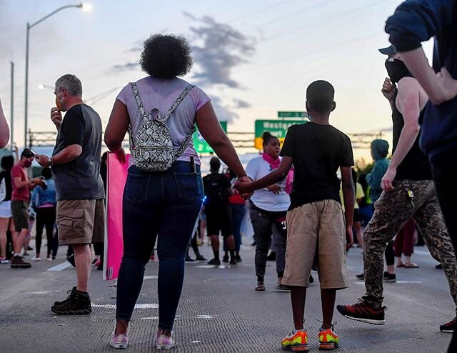 A woman and child hold hands as they stand back from tear gas on the Bowen Bridge in Asheville May 31, 2020.
.
.
.
.
.
#asheville #avl #828 #avlnews #ashevillephotographer #wnc #nc #blacklivesmatter #georgefloydprotest