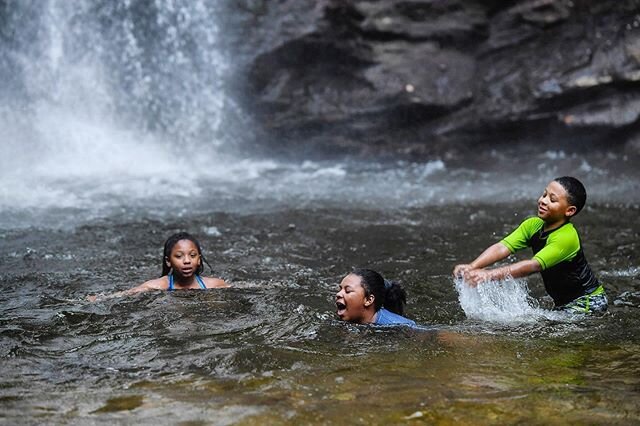 From left, siblings Makayla, 11, Aniyah, 9, and Josiah McDowell, 8, of Forest City, splash and cool off in the water below Looking Glass Falls in the Pisgah National Forest in Brevard June 12, 2020. It was their first time visiting.
.
.
.
.
.
#lookin