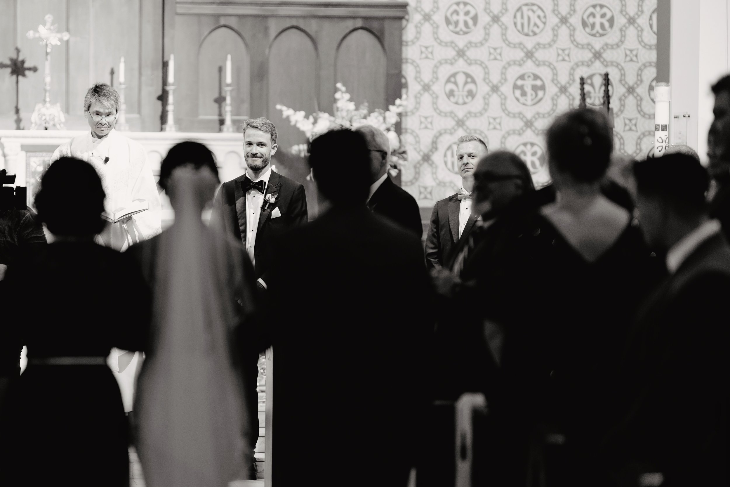 bride walking down aisle at Shrine of Our Lady of Good Voyage