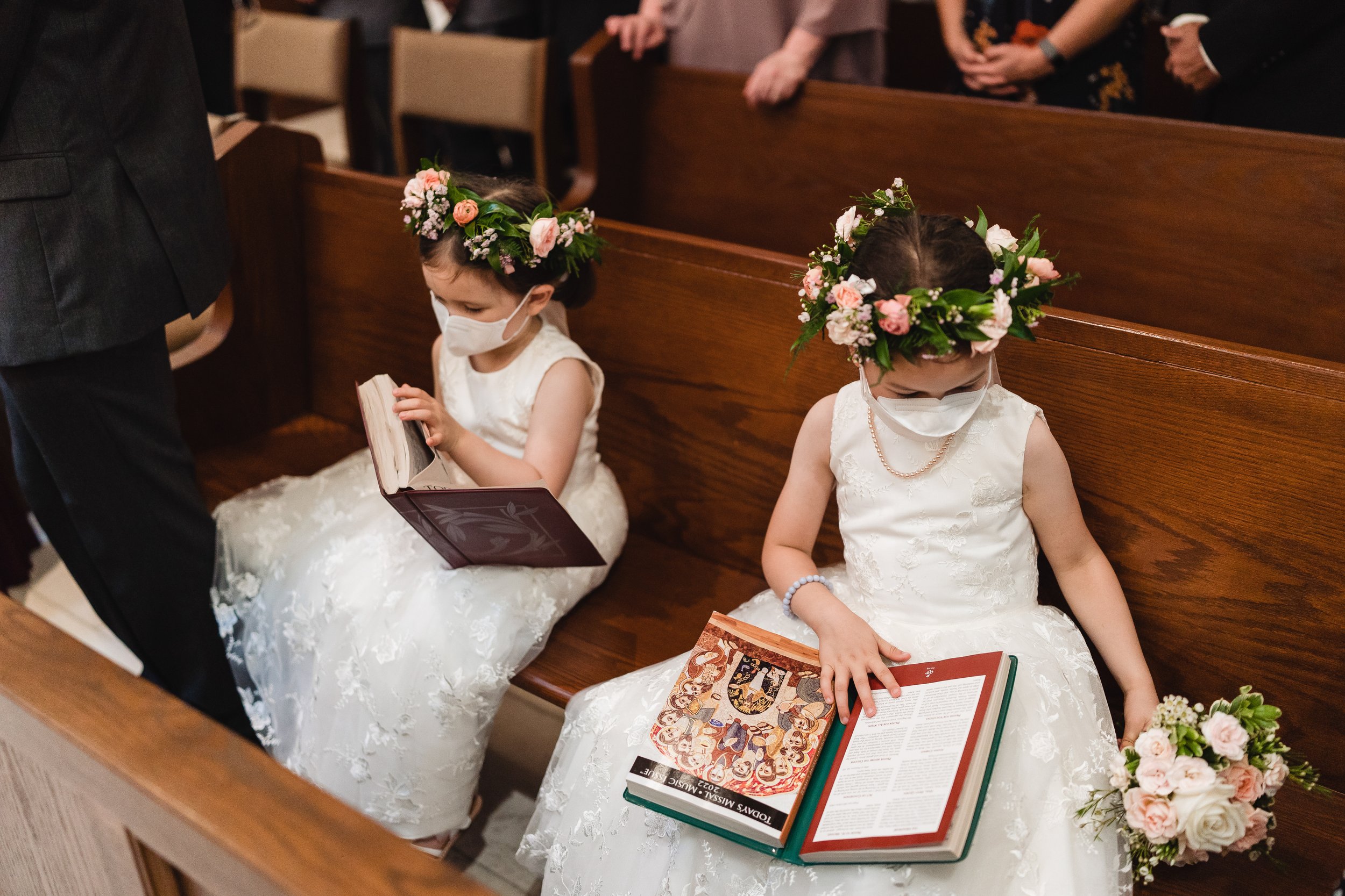 wedding ceremony at bride walking down aisle at Shrine of Our Lady of Good Voyage