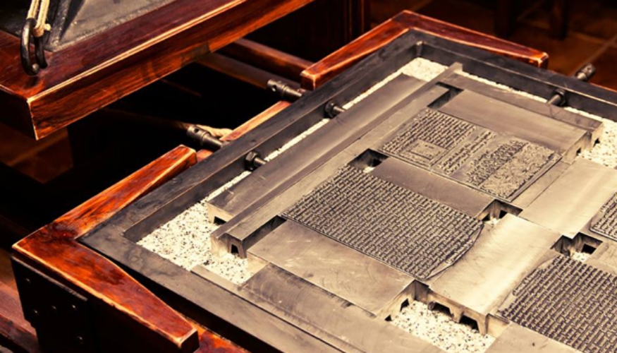 Printer in Juan de la Cuesta's 17th century print shop, similar to the one used to print Don Quixote .