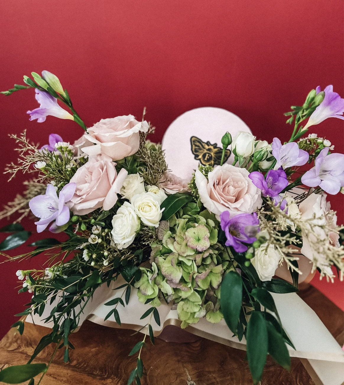 La Belle Fleur floral hatbox with blush roses, hydrangea and purple seasonal flowers by Edmonton luxury florist
