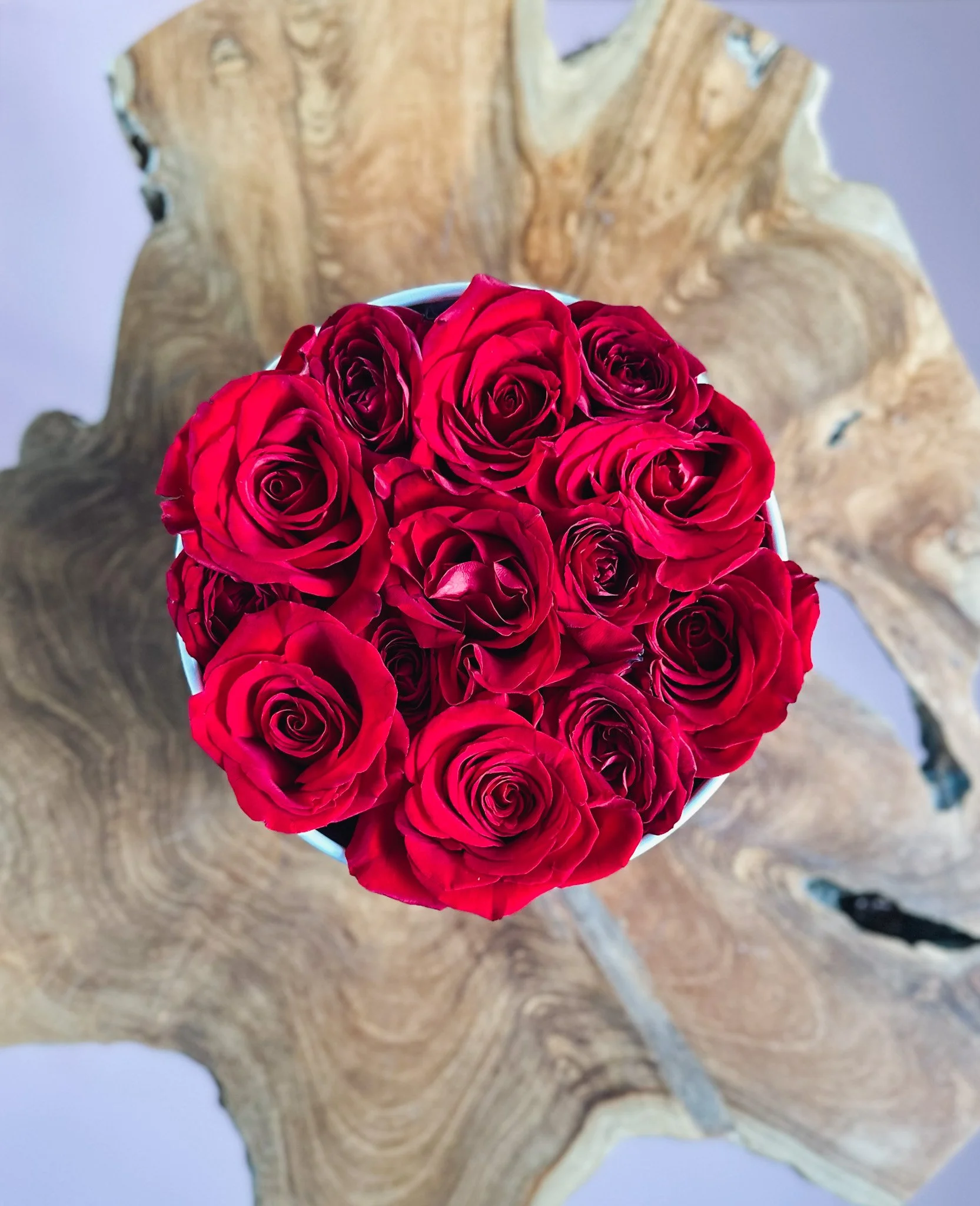 Red rose arrangement in a white hat box for Valentine’s Day, available for delivery in Edmonton, St. Albert and surrounding areas.