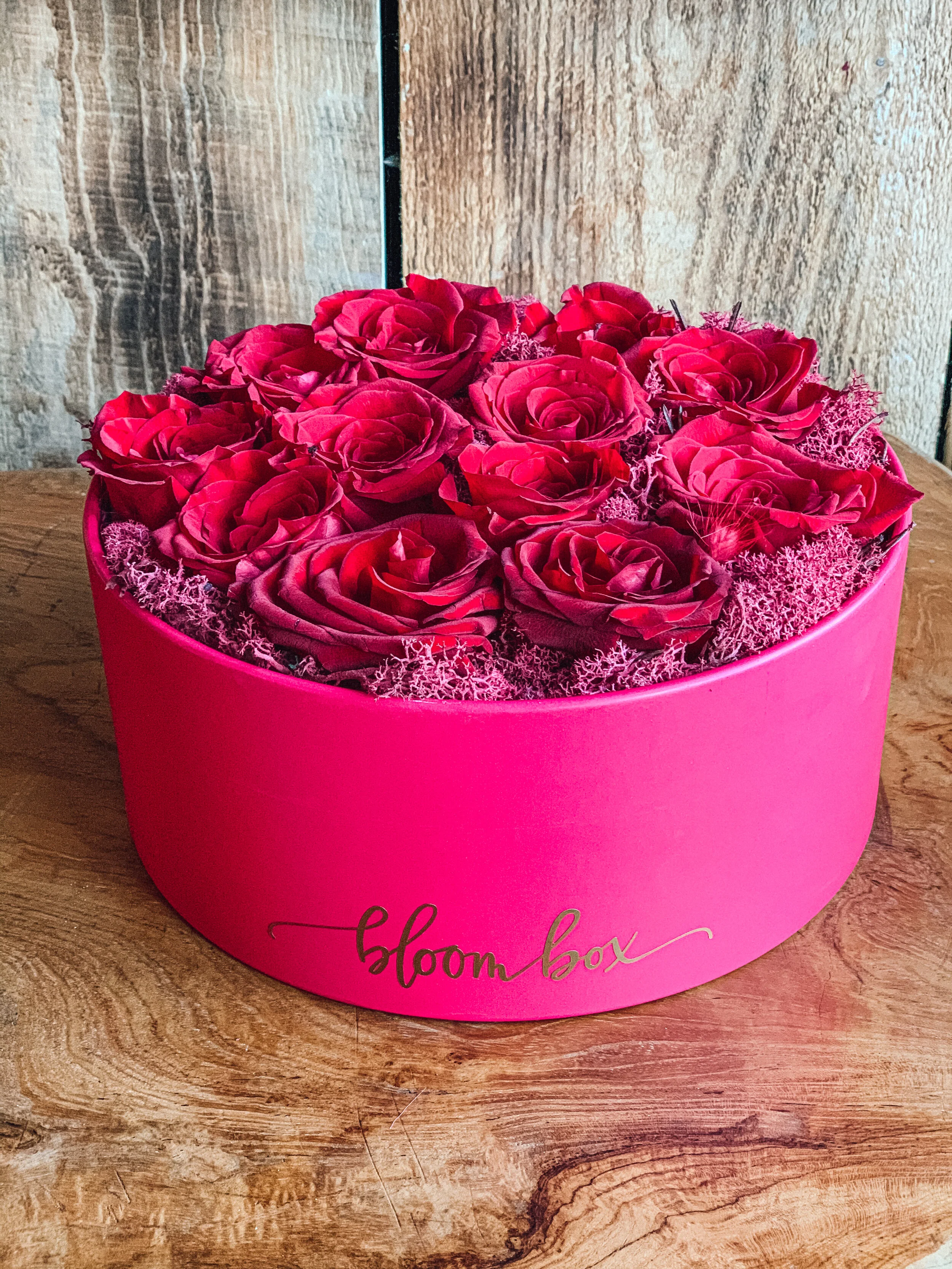 Red rose heart box arrangement in a pink hat box for Valentine’s Day, available for delivery in Edmonton, St. Albert and surrounding areas.