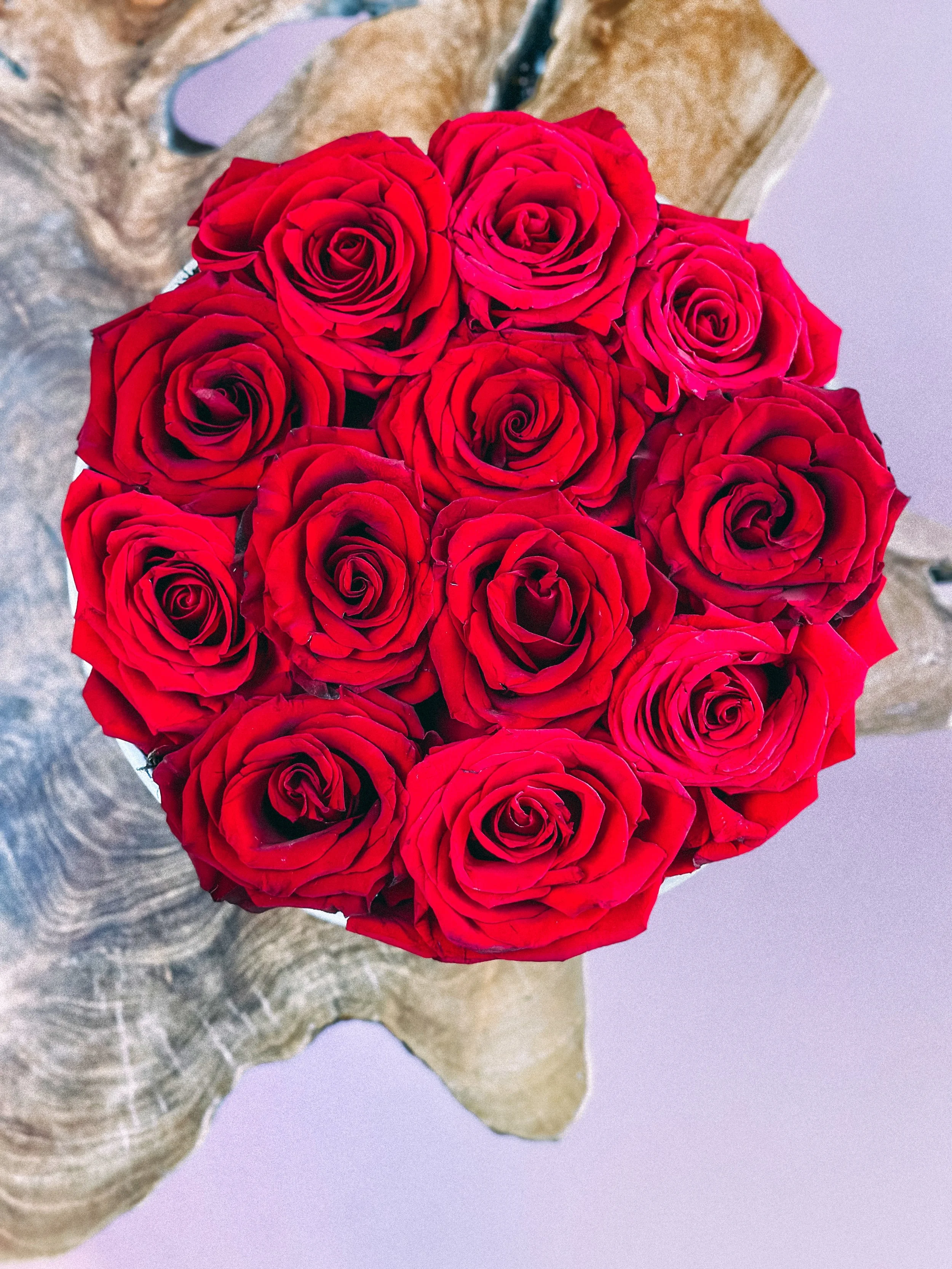 Red rose heart box arrangement in a pink hat box for Valentine’s Day, available for delivery in Edmonton, St. Albert and surrounding areas.