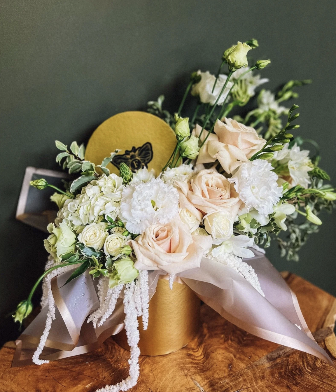 La Belle Fleur designer’s choice floral hatbox in gold with blush roses, white ranunculus and seasonal blooms, Edmonton florist