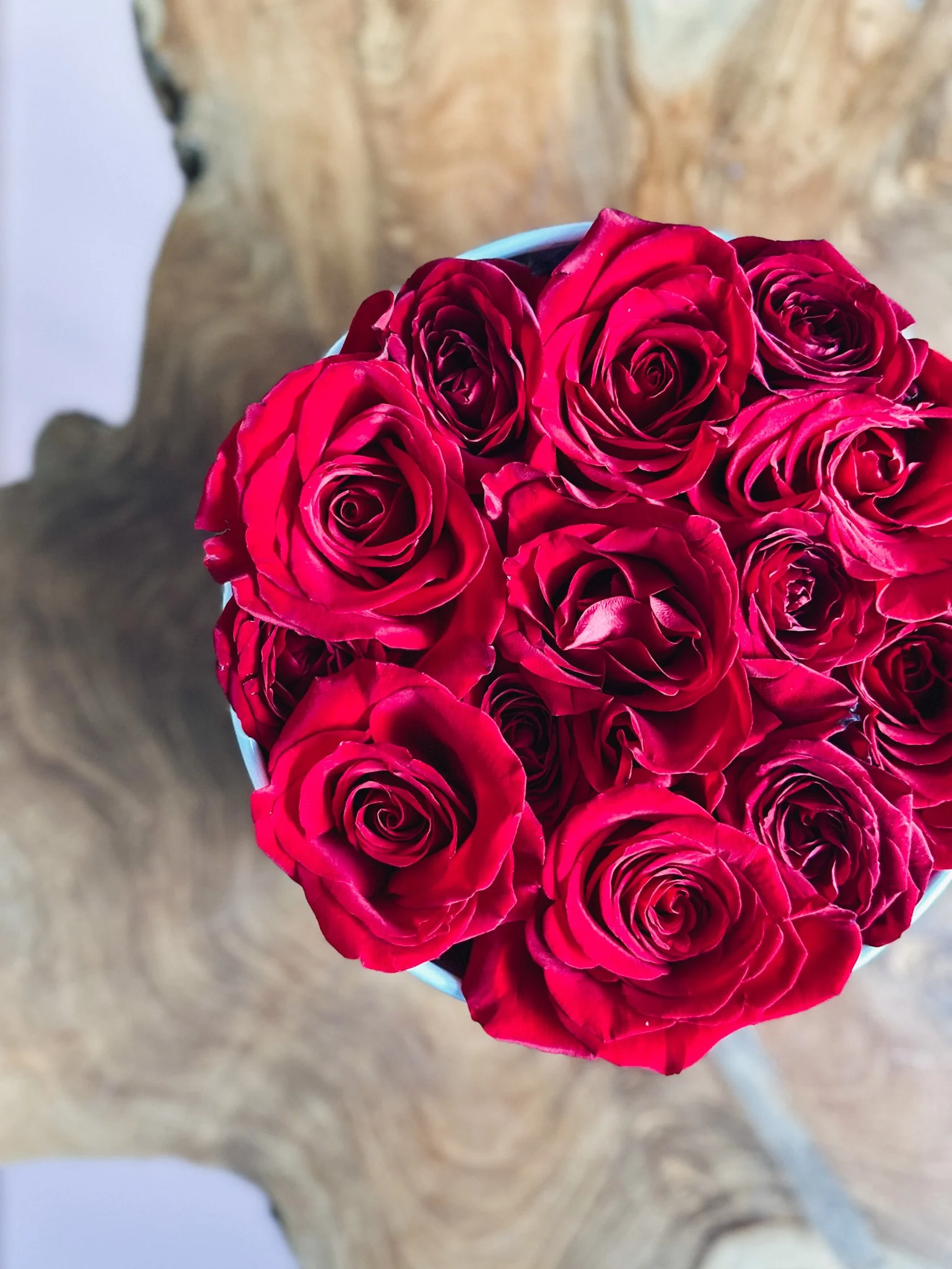 Red rose arrangement in a white hat box for Valentine’s Day, available for delivery in Edmonton, St. Albert and surrounding areas.