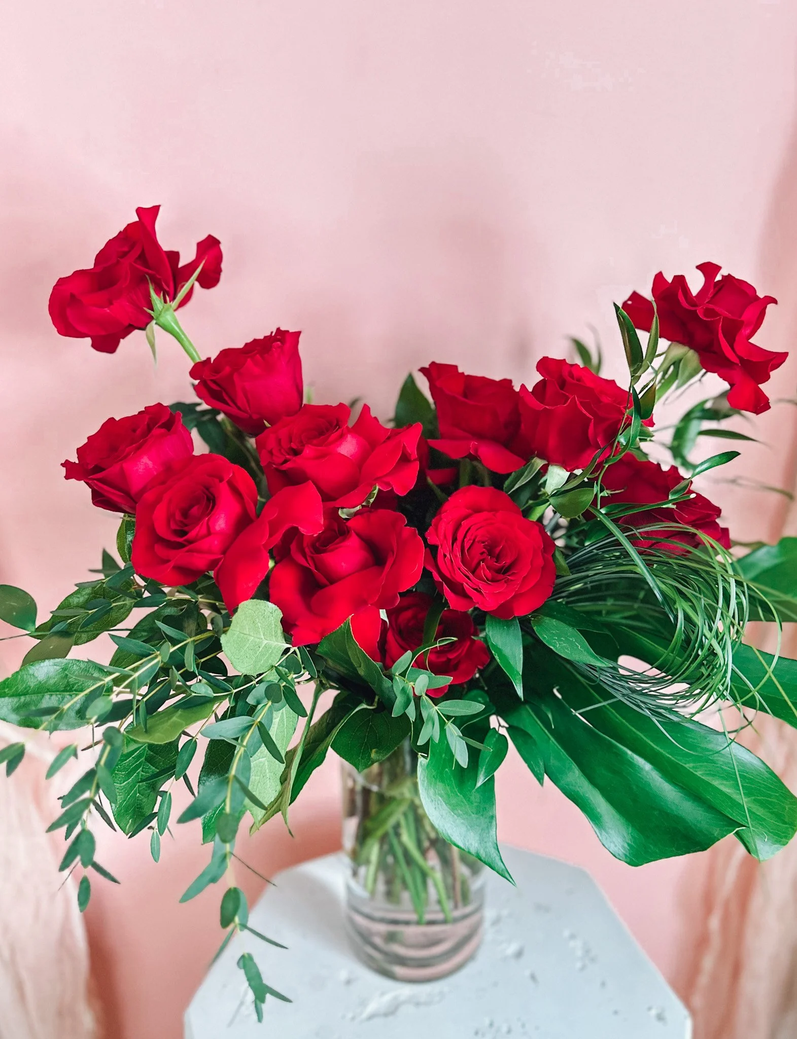 Luxury red rose Valentine’s Day arrangement in a clear glass vase available for Edmonton St Albert and Sturgeon County flower delivery