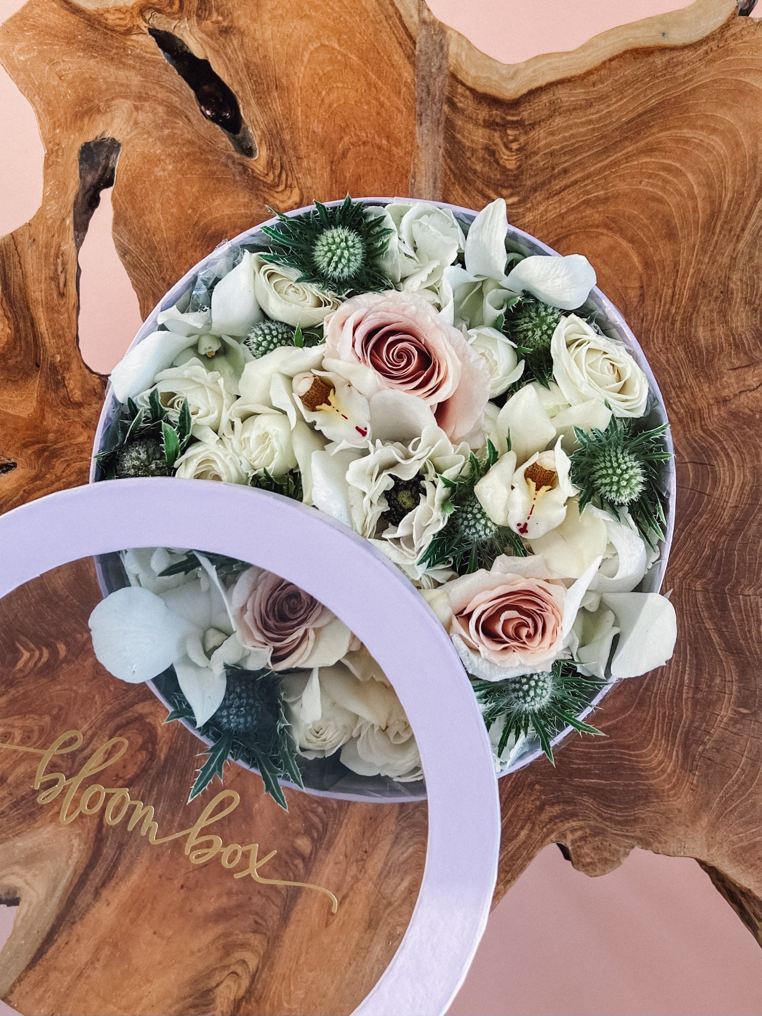 Elegant white and blush preserved flower arrangement in a round bloom box, soft romantic floral design by Edmonton florist