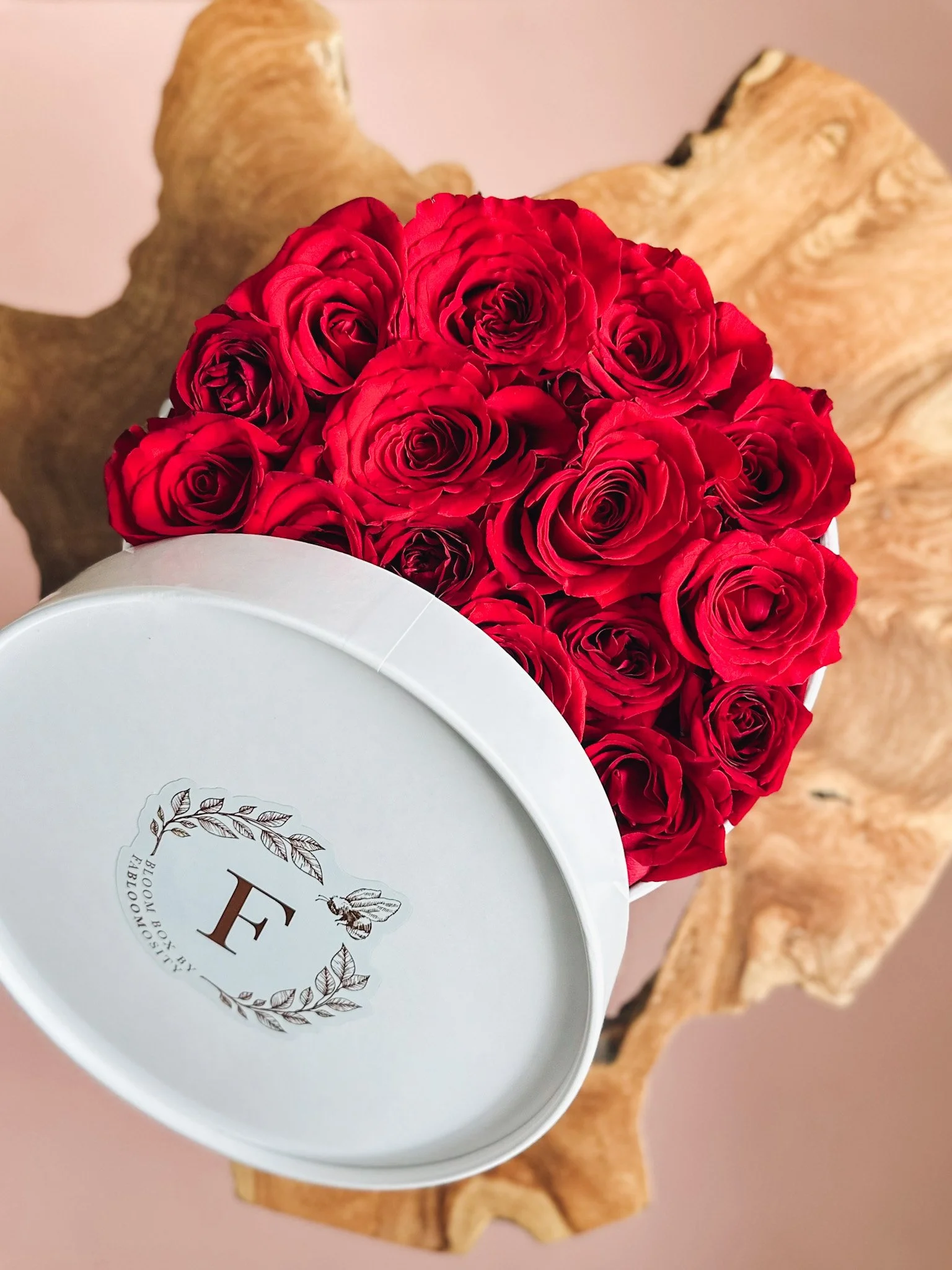 Red rose heart box arrangement in a white hat box for Valentine’s Day, available for delivery, Edmonton, St. Albert and surrounding areas.