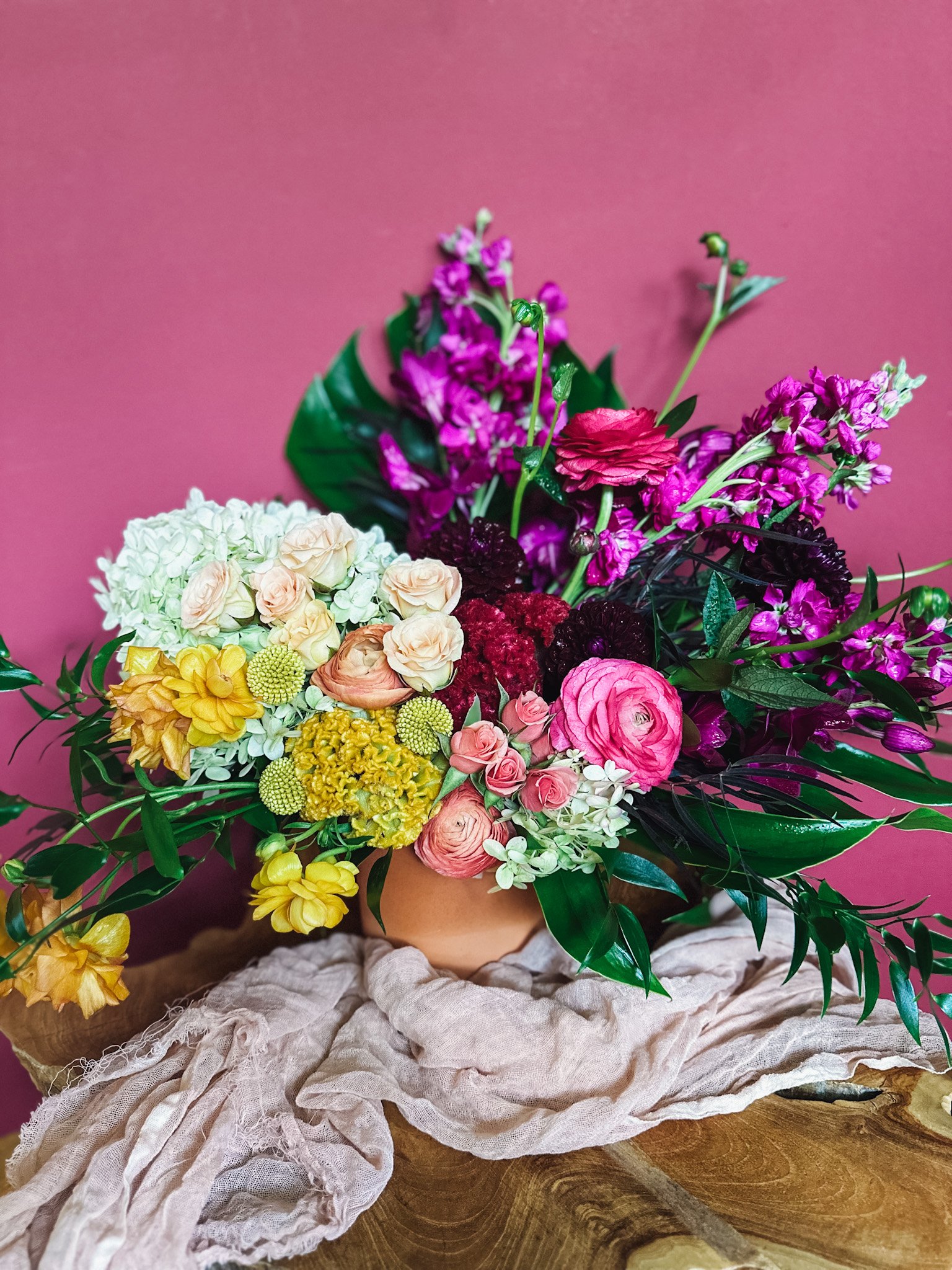 Colourful mixed flower arrangement in clay vase, Edmonton and St. Albert same-day flower delivery”