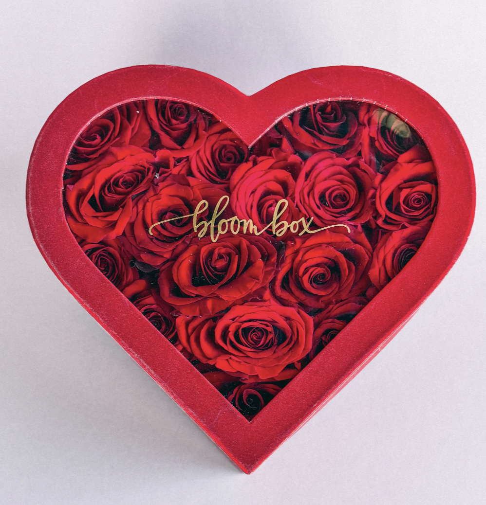 Heart Beat Box featuring red preserved roses arranged inside a red heart-shaped Bloom Box lid