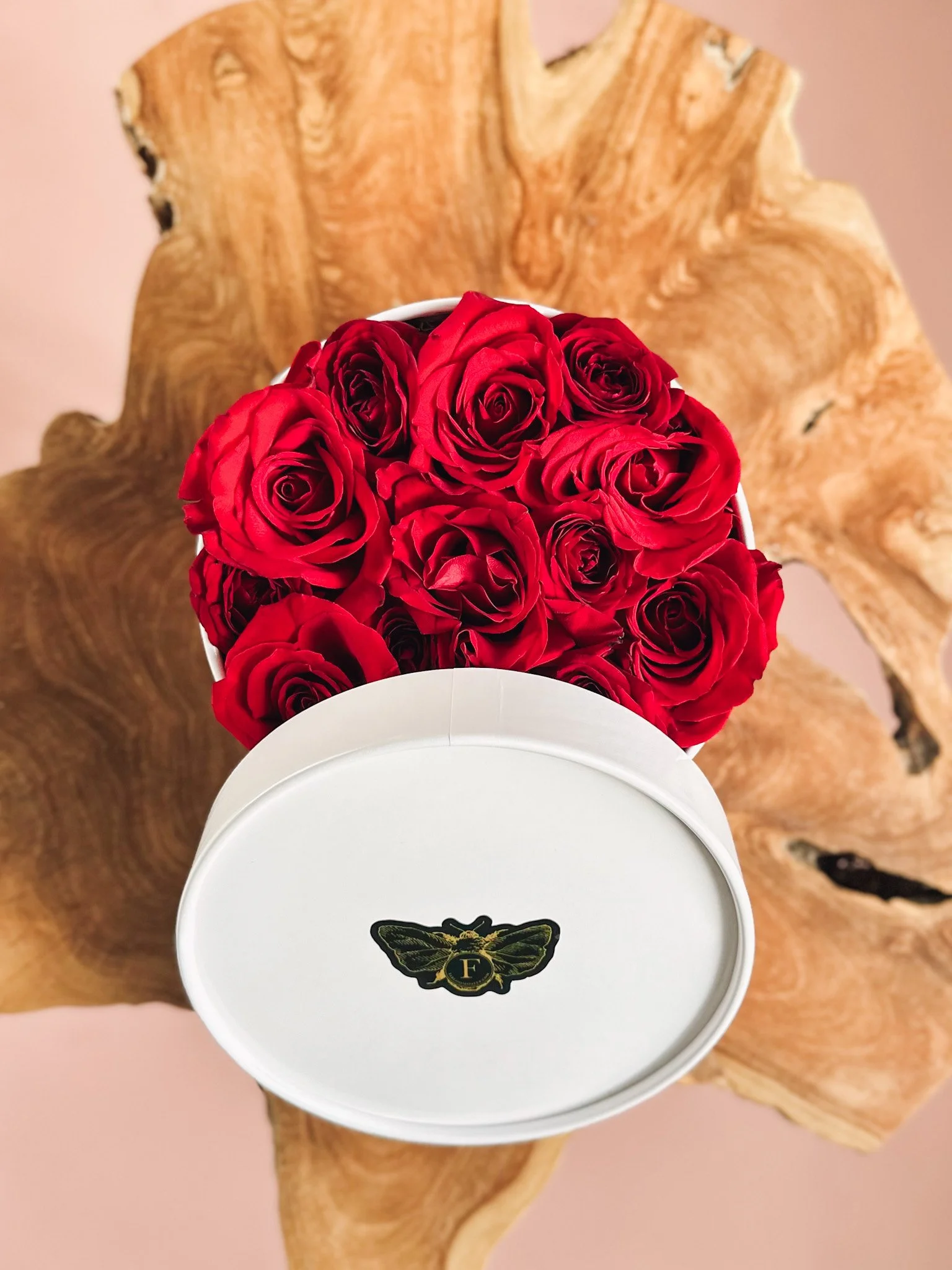 Red rose arrangement in a white hat box for Valentine’s Day, available for delivery in Edmonton, St. Albert and surrounding areas.