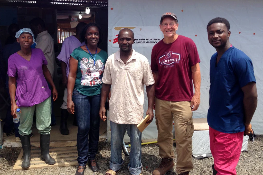 Staff and some survivors pose with Dr. Daniel Lucey in Monrovia, Liberia as he and local health teams battled against last year’s Ebola crisis.