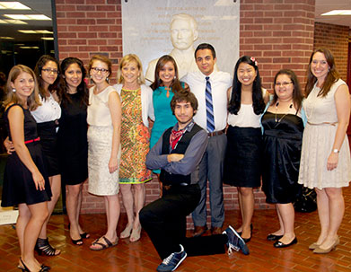 Jane Genster, fifth from left, now president and CEO of the Cristo Rey Network, poses with Georgetown student mentors of Cristo Rey and KIPP students participating in the 2013 Summer Immersion program. Program director Kyle Burns is pictured far right, with assistant director Katie Suter far left.