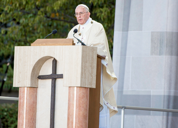 Pope Francis stands at the lectern, which displays the historic iron cross provided by Georgetown, during Mass at the Basilica of the National Shrine of the Immaculate Conception on Sept. 23. Photo by Ed Pfueller, Catholic University of America