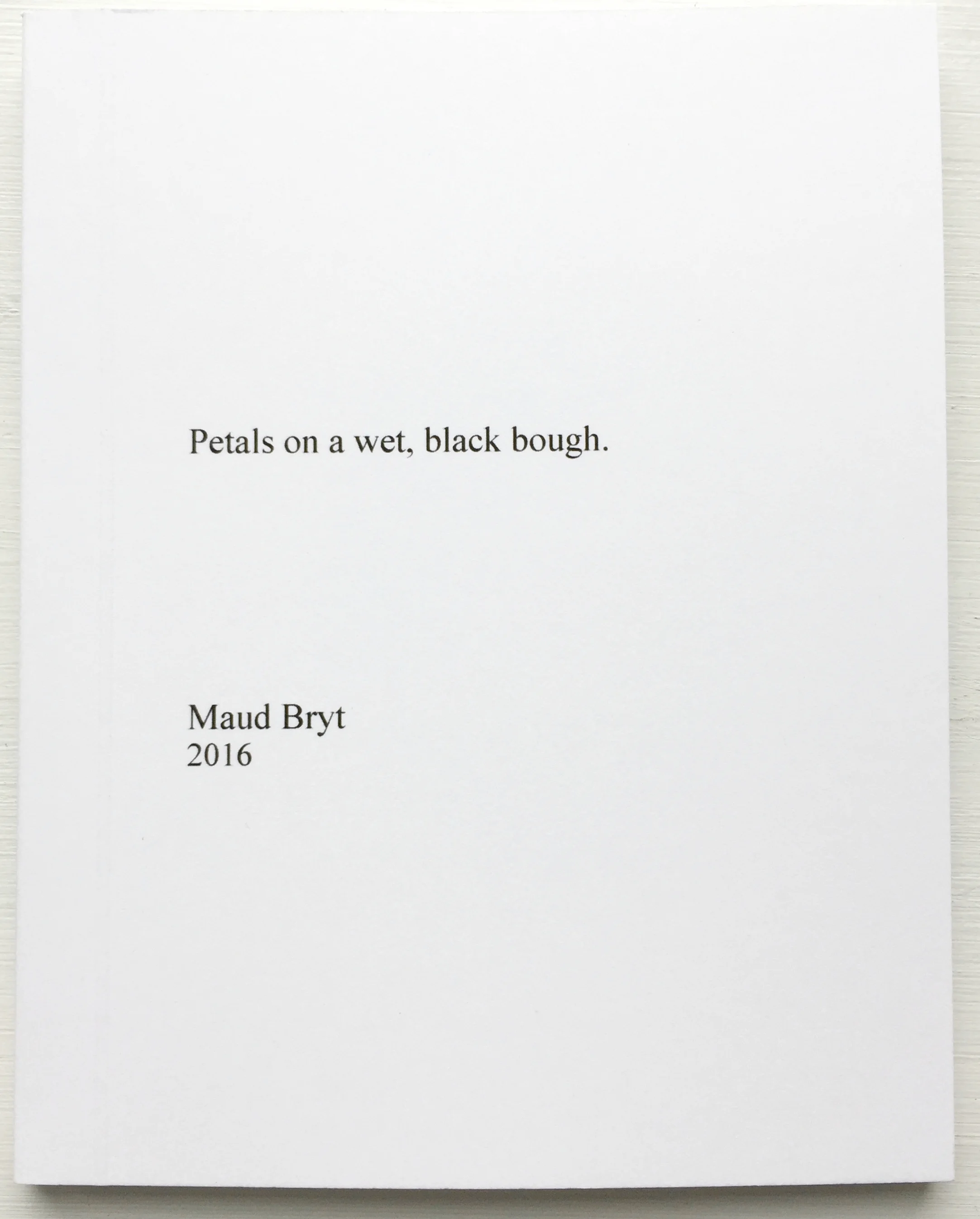 Petals on a wet, black bough. BOOK