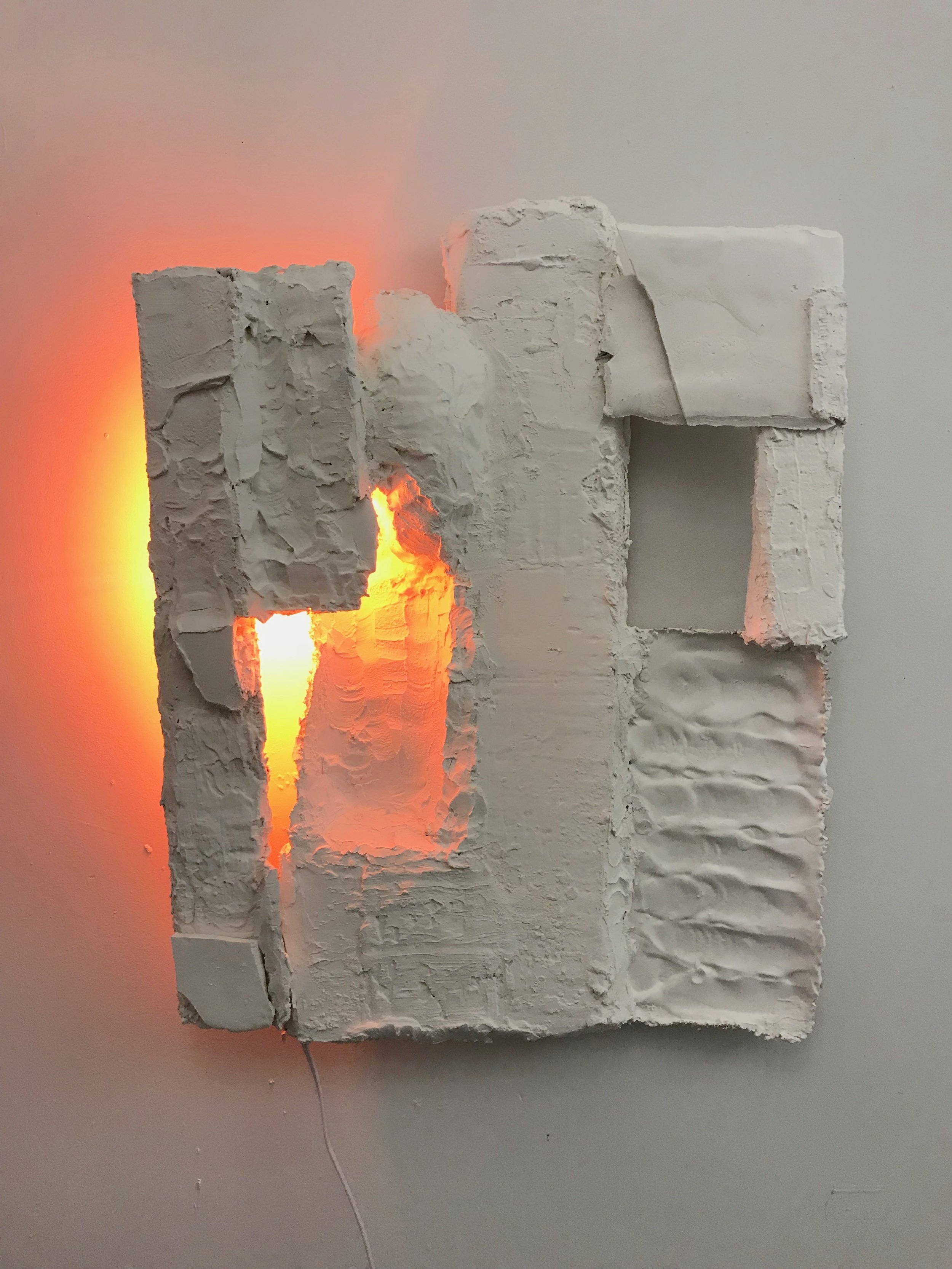 She Didn't Think It Showed Really, 2017. Plaster, burlap, lightbulb. (wall hanging) As seen in  COLORSCULPTURE exhibit in DUMBO Brooklyn, NY, 2017.