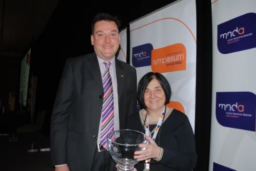 Dr. Matthew Kiernan, Last year's recipient, presents the Forbes Norris award to Dr. Terry Heiman-Patterson.
