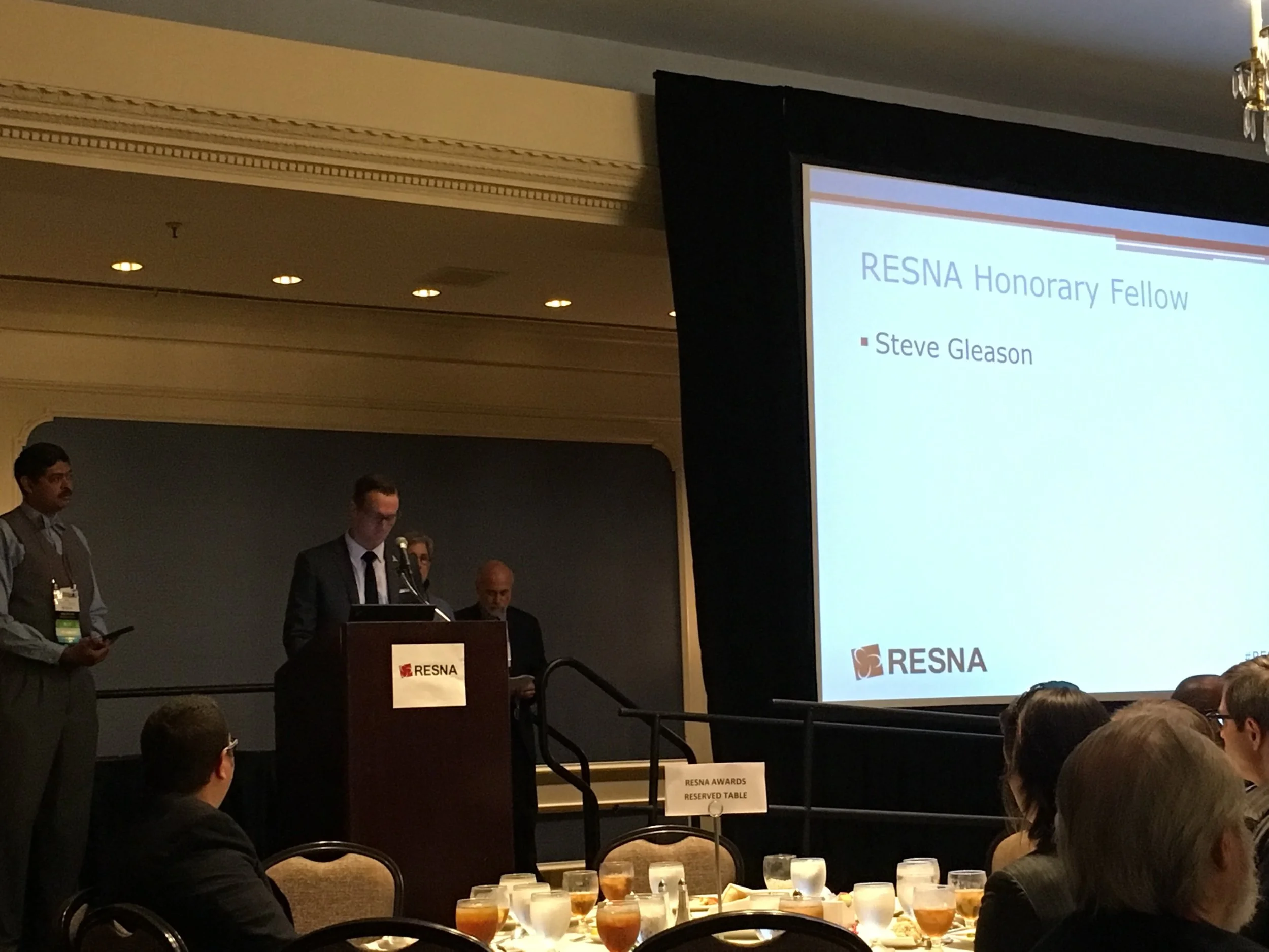Blair Casey accepts the Honorary Fellow Award on Steve Gleason's behalf.