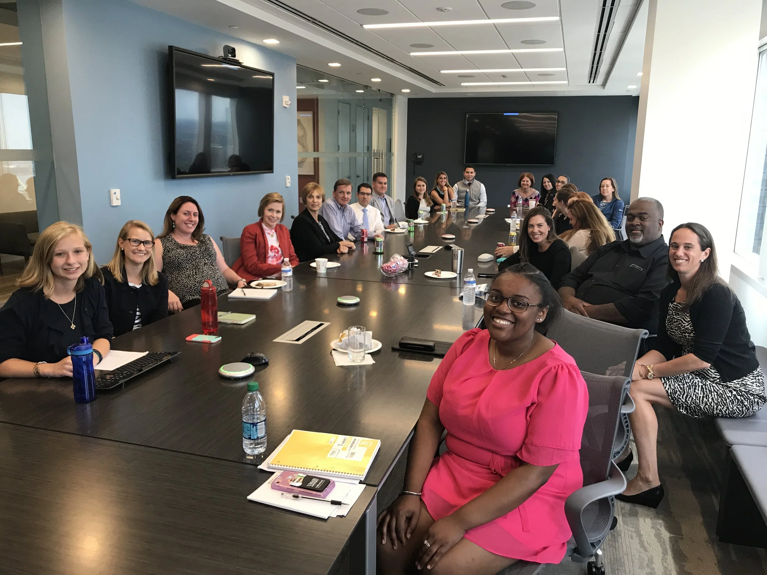 Boston fellows Zoe Flessas-Finocche of Milton Academy in Milton (l) and Ariel Mullings-Bent of Codman Academy in Dorchester (r) present their research findings to associates at Brown Advisory.