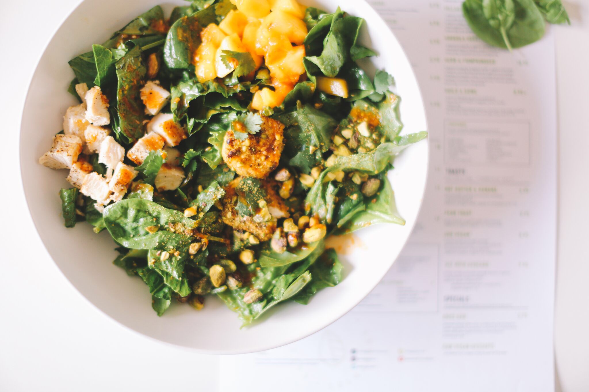 TROPICAL CHICKEN: organic romaine ~ organic spinach ~ chicken ~ organic seasonal fruit ~ pistachio ~ organic cilantro ~ goat cheese || dressing: cilantro/lime/ginger OR sriracha || 10.95 *suggested add-ons: avocado & feta cheese