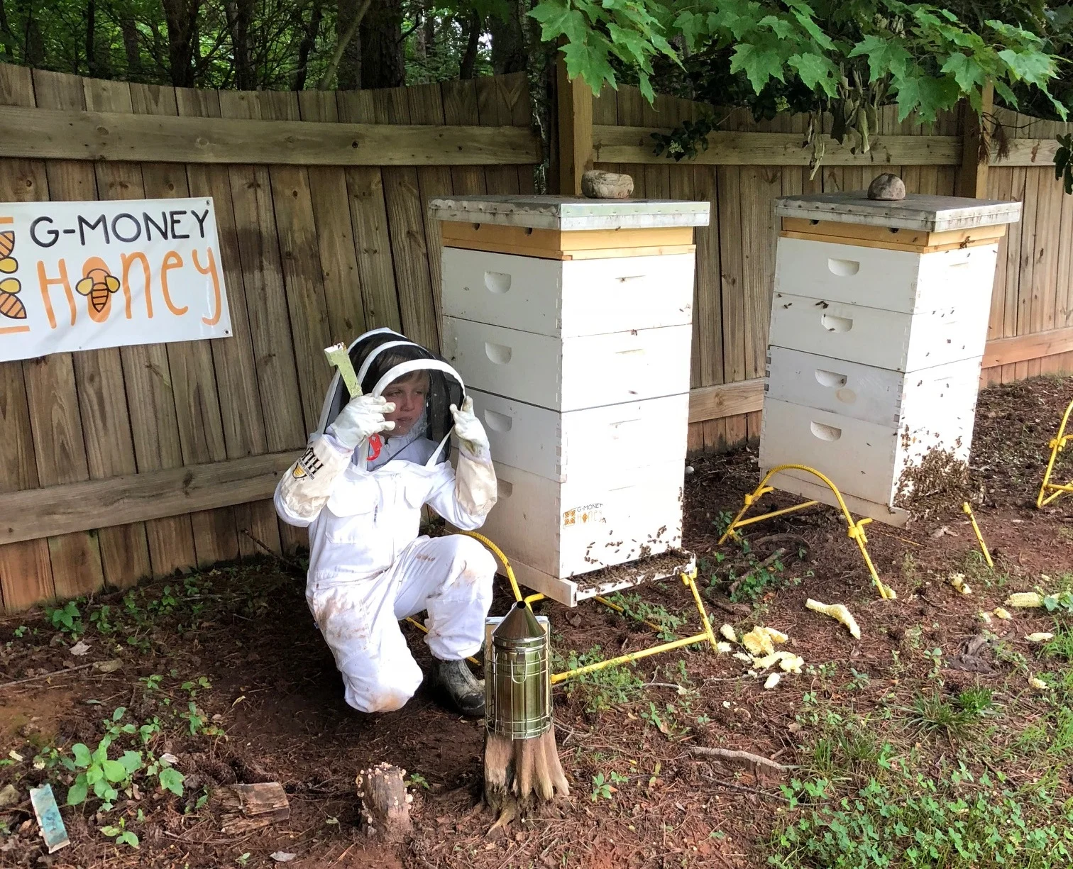 Grayson at work with his bee hives. Photo: Aubrey Linville