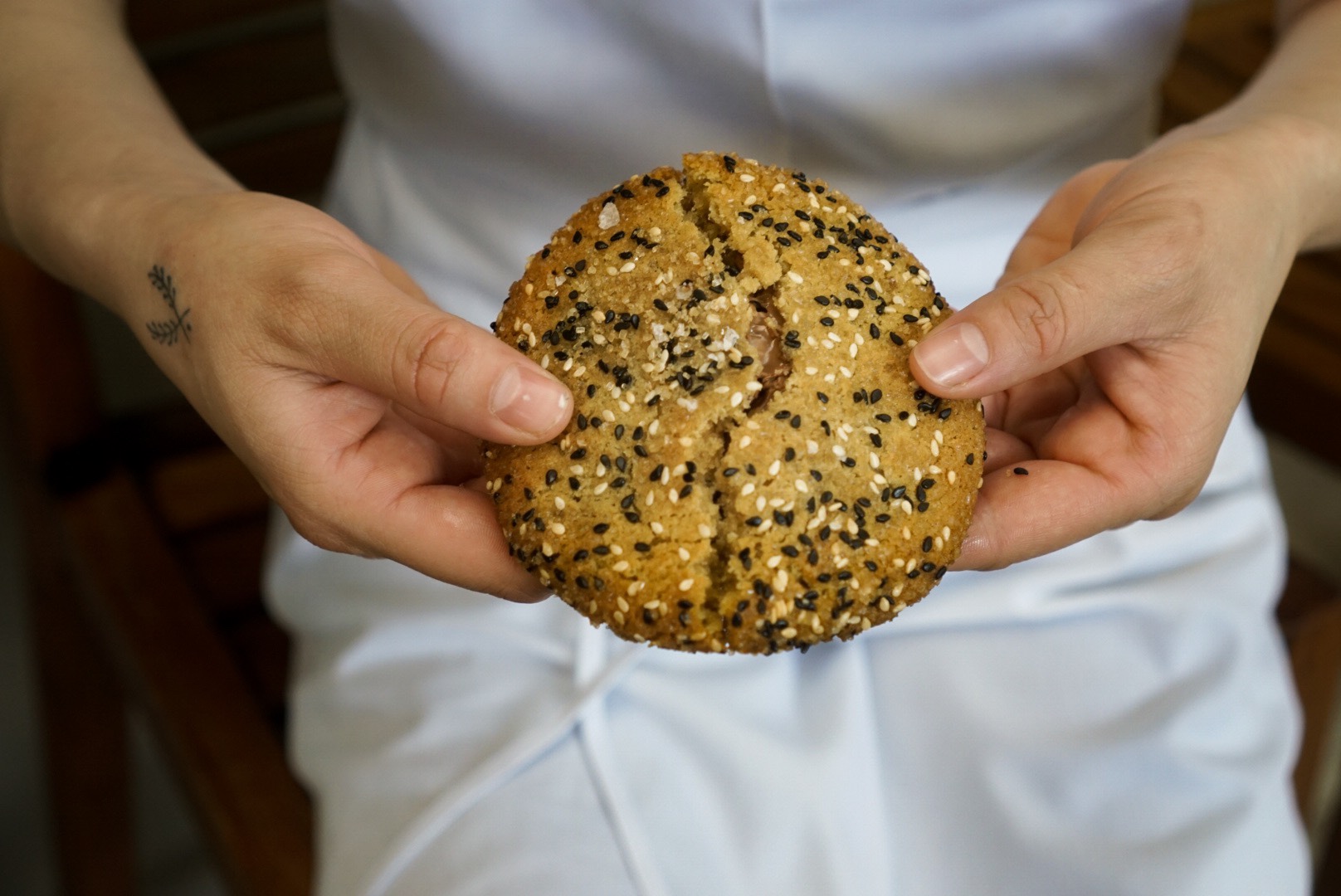 The result of lots and lots of testing, this cookie is incredibly delicious. (Can you imagine the lucky folks who get to eat the “mistakes”?) This final version is a Tahini Shortbread rolled in Sesame Seeds filled with Valrhona Caramelia