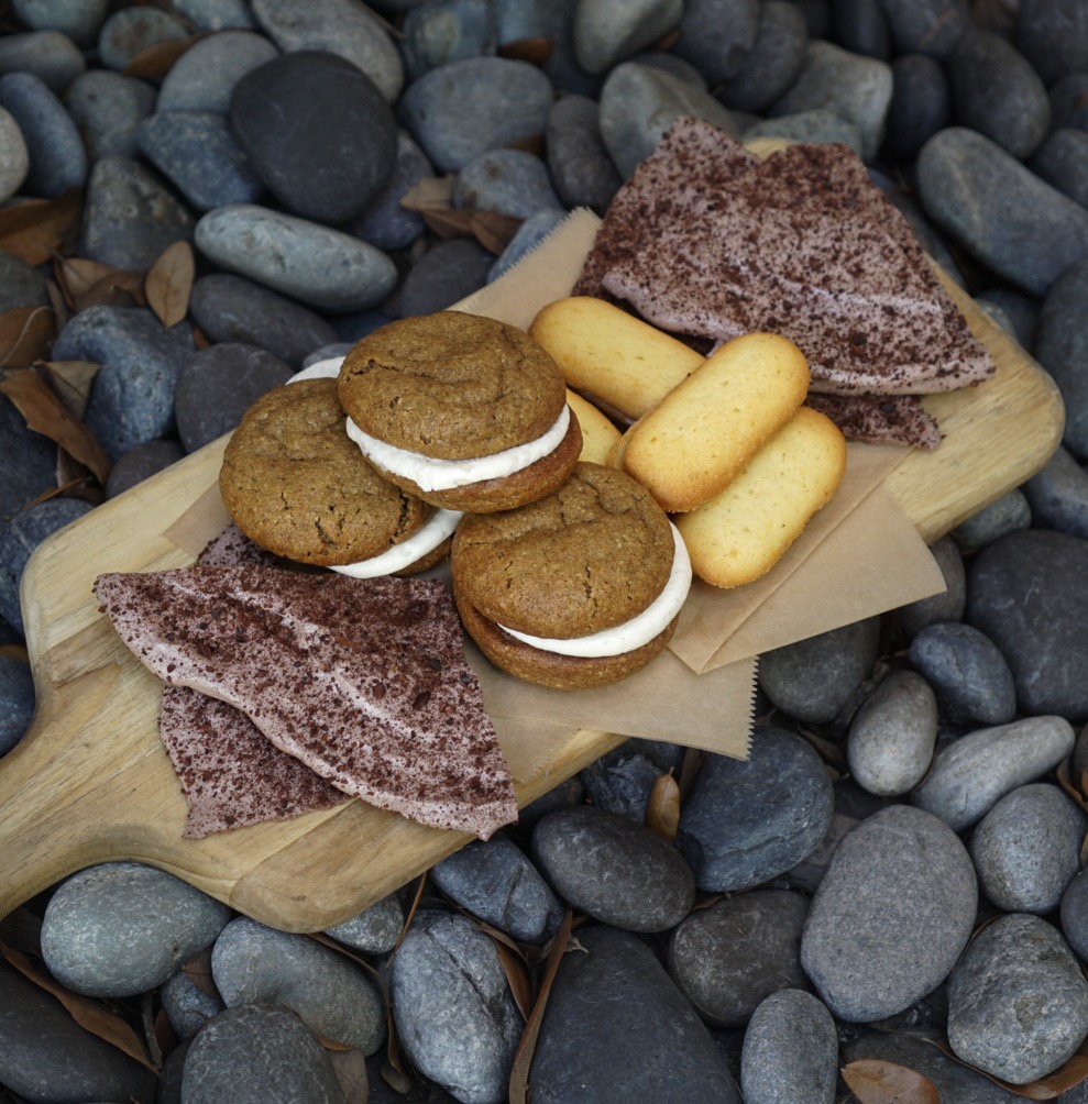 Some of Devin’s creations currently at Ariete include And on the board are: Cacao Nib Meringues, Steel Cut Oatmeal Cream Pies and Orange Milanos with Chocolate Hazelnut Ganache.