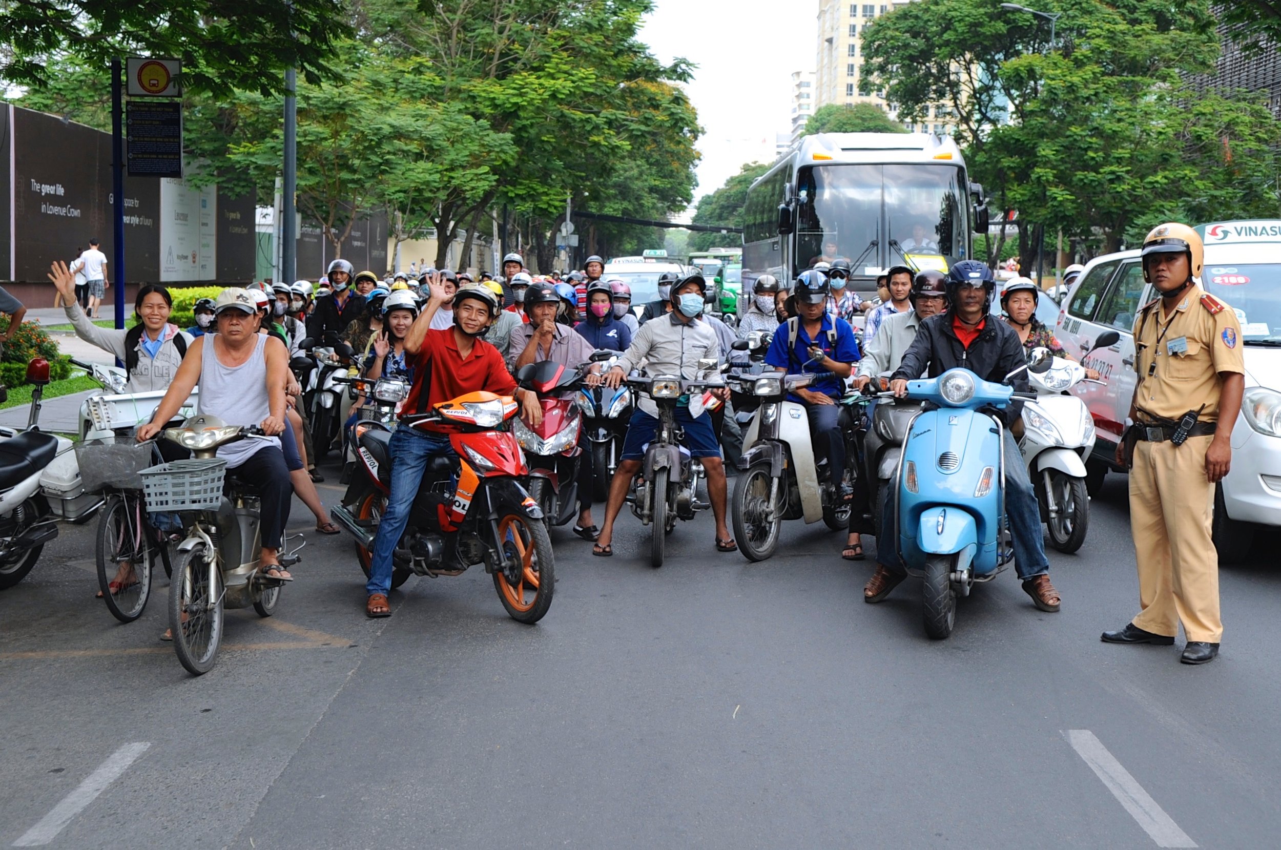  Bike riders waiting at the instruction of a police officer for our party to cross the street. 