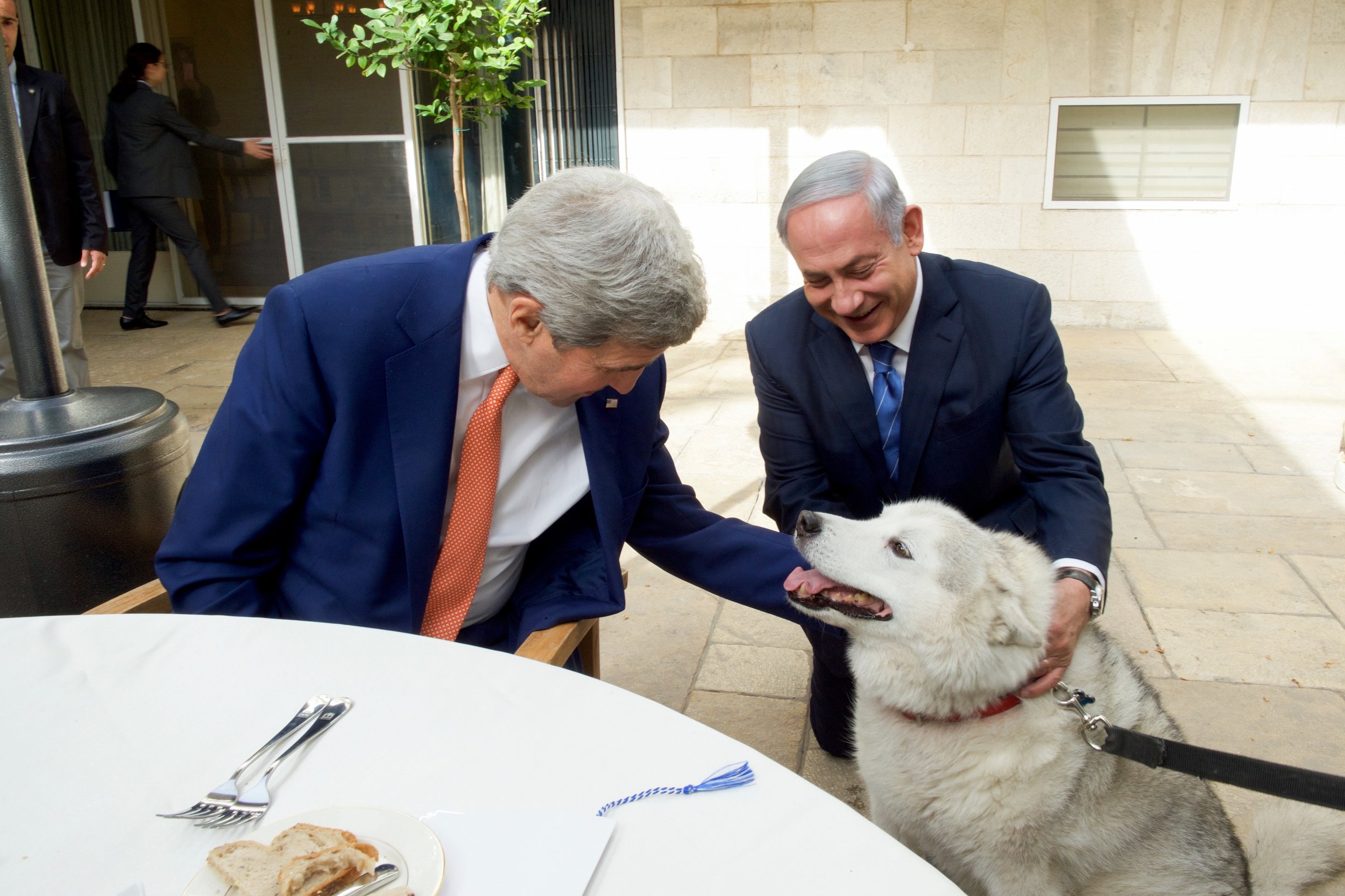Prime Minister Netanyahu introduces Secretary Kerry to his dog, Kaiya, during a meeting at his official residence.