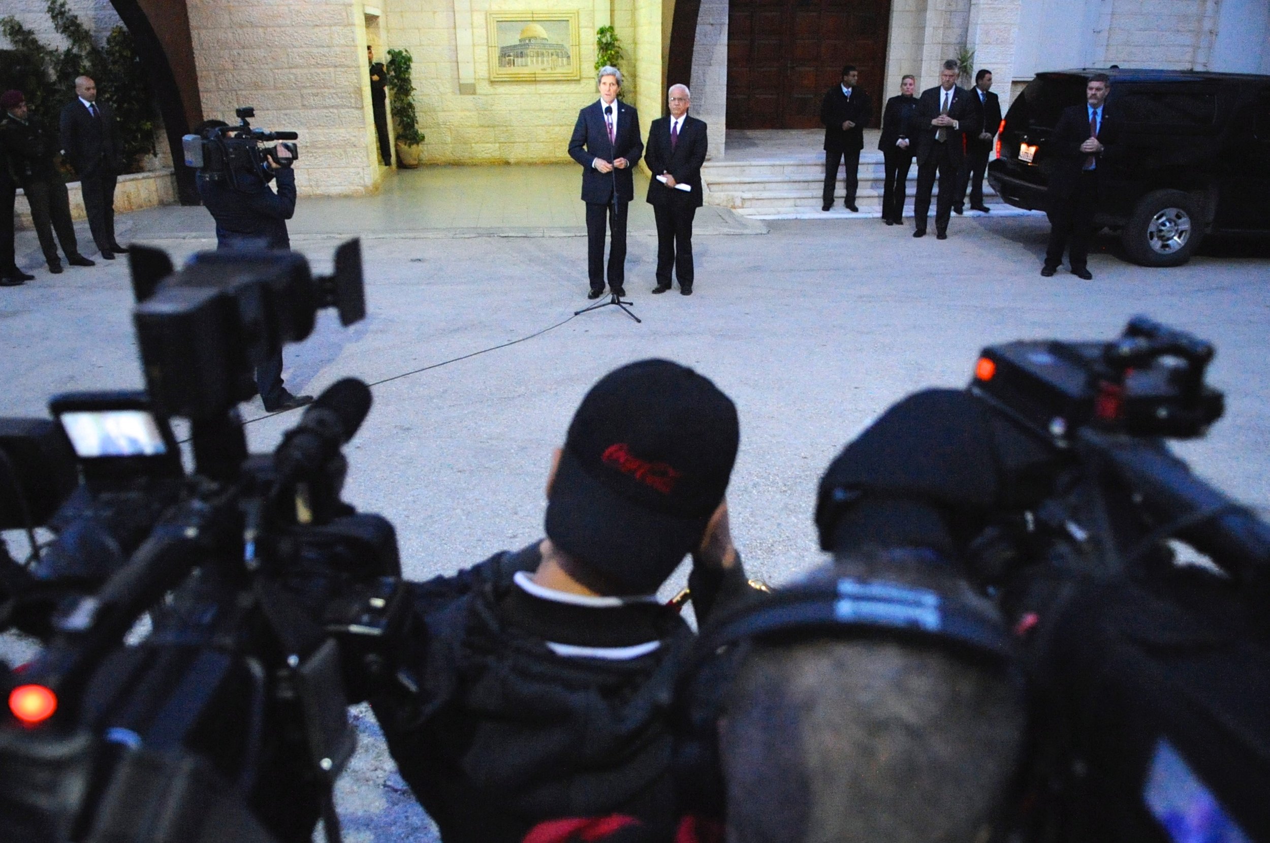  Secretary Kerry and Saeb Arakat address reporters outside the Palestinian Authority Headquarters in Ramallah, West Bank. 